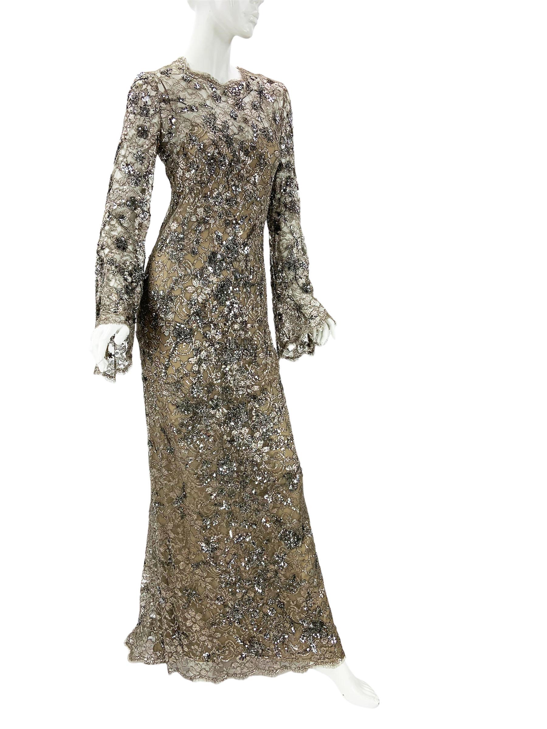 Vintage Oscar de la Renta Fully Embellished Smoky Gray Lace Dress Gown 
US size - 10
Smoky gray color lace with silver metallic floral embroidery embellished with silver tone sequins and smoky gray color beads. A-line silhouette,  Bell sleeves, Back
