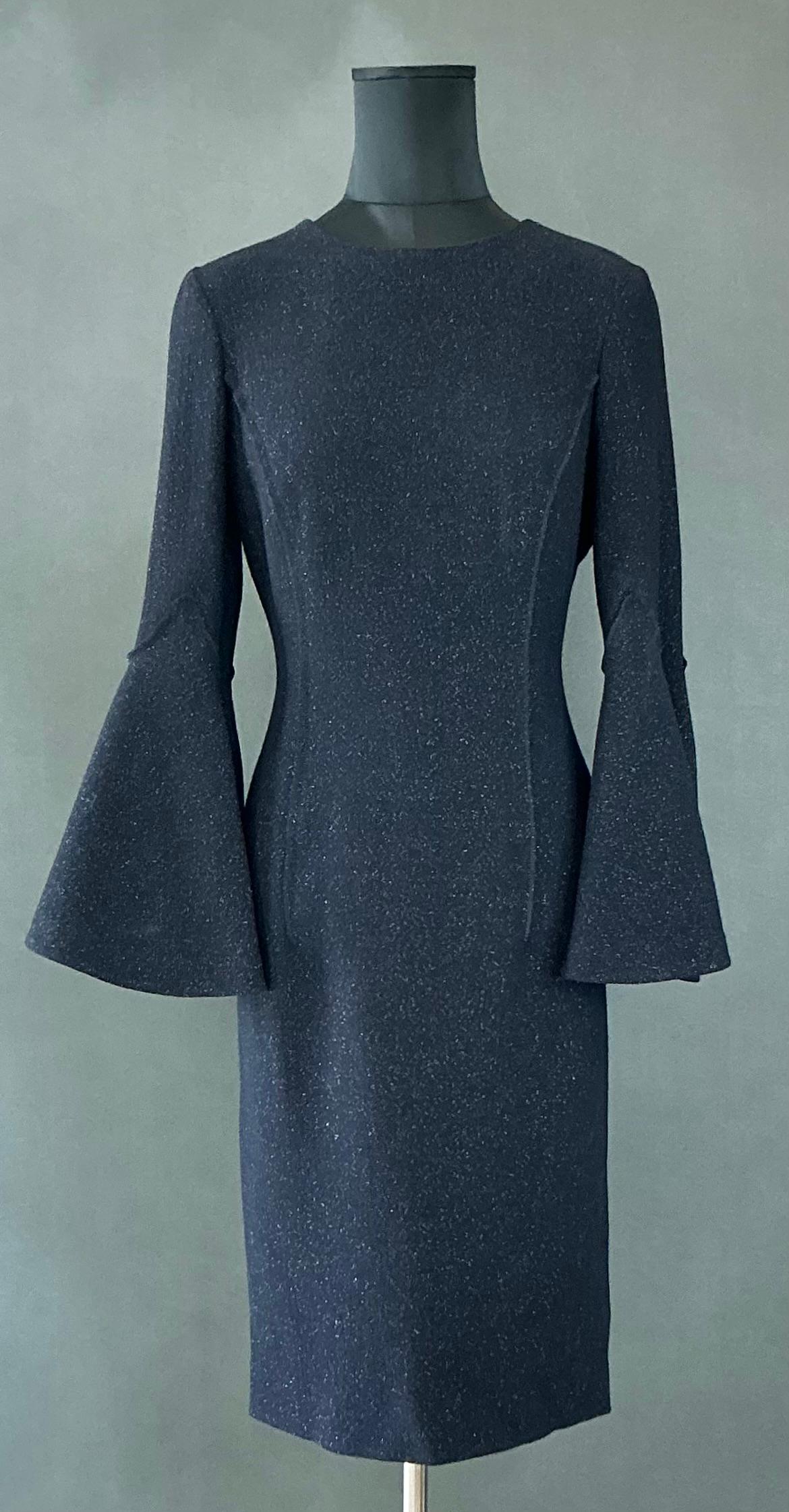 This Vintage Oscar de la Renta Navy Dress with Butterfly Sleeves is a stunning example of the renowned designer’s timeless elegance and flair for creating feminine, sophisticated pieces. Known for his luxurious fabrics, impeccable tailoring, and
