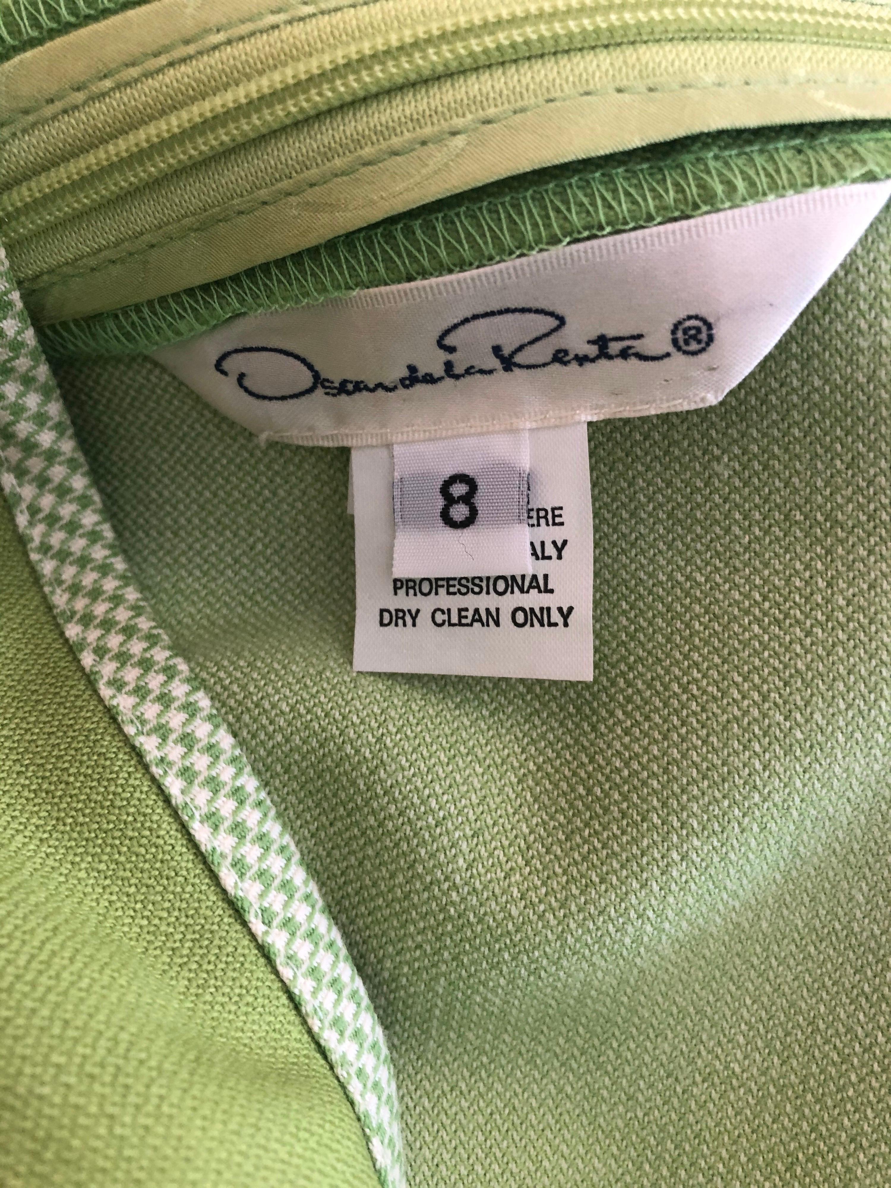 Chic and effortless vintage late 90s OSCAR DE LA RENTA lime green sheath dress! Features four panels of lime green and white gingham down the front and two down the back, and around the beck. Hidden zipper up the back with hook-and-eye closure. Can