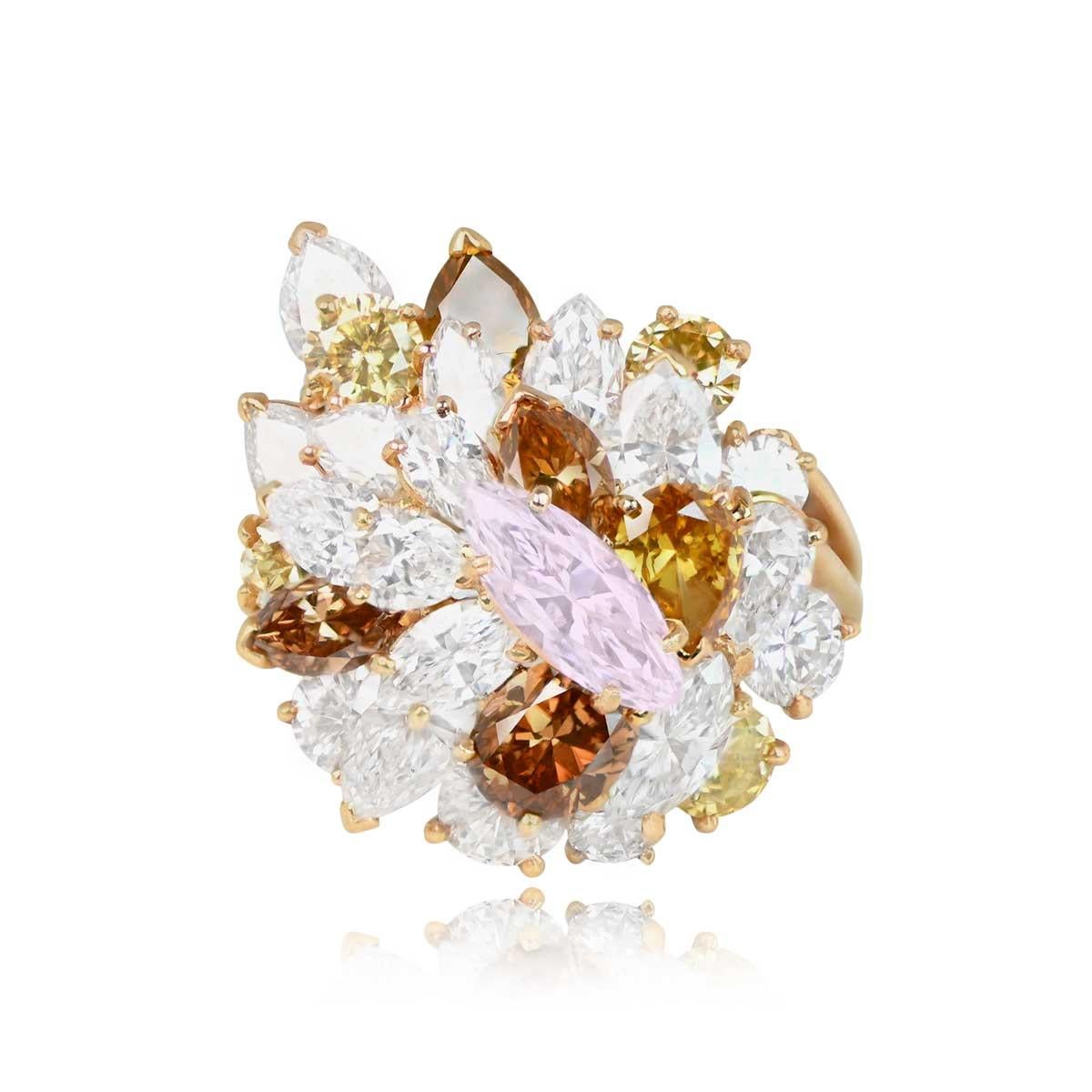 This stunning Oscar Heyman cluster ring features a natural light pink marquise-shaped diamond at its center, weighing approximately 0.75 carats with VS1 clarity. Adorned with a cluster of round brilliant cut, pear-shaped, and marquise-shaped