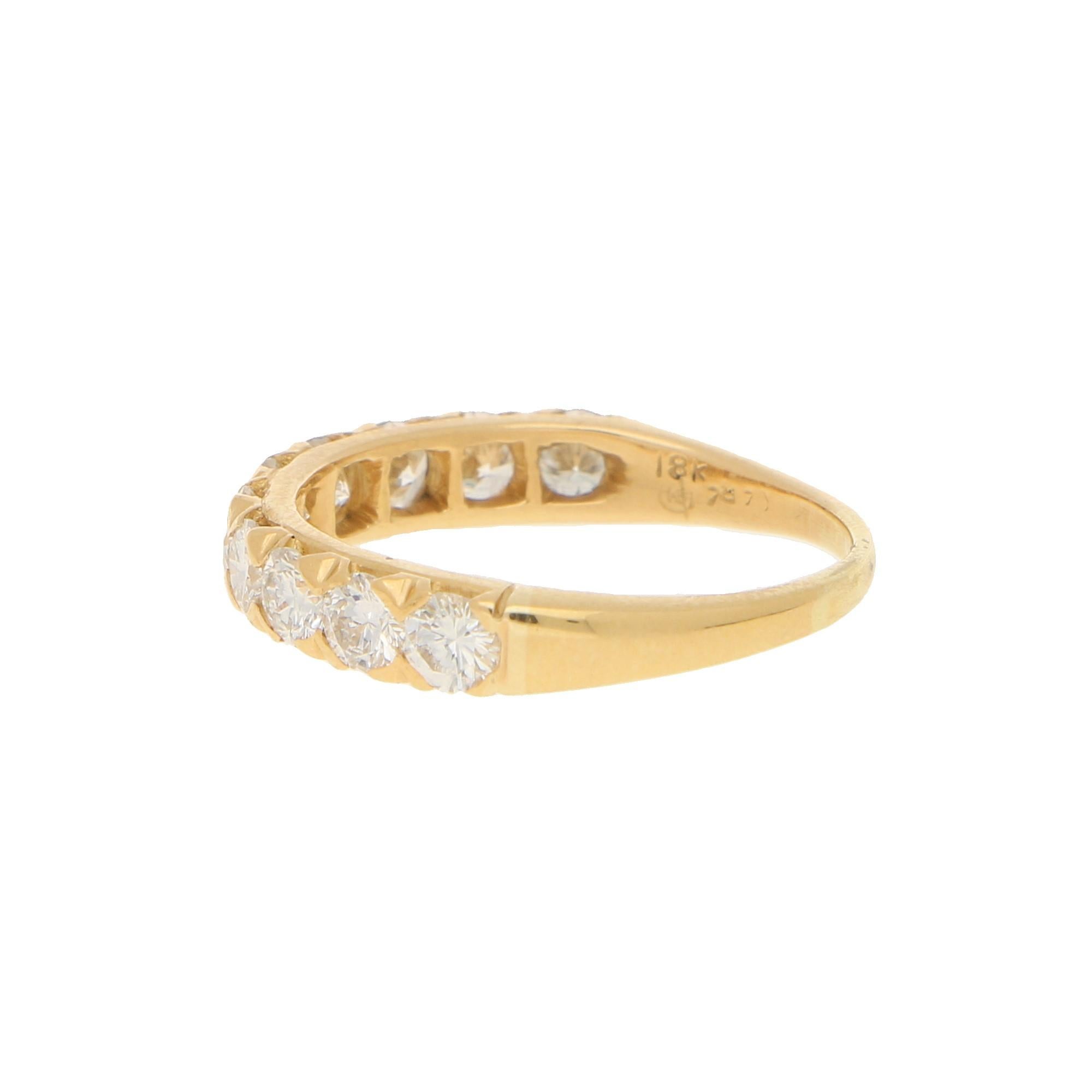 Diamonds approximately 1.30 carats in total, F/G colour, VS-SI clarity.
A vintage Oscar Heyman diamond half-eternity ring in 18-karat yellow gold. 
The ring features ten round brilliant-cut diamonds seamlessly shared-claw-set throughout the shank,