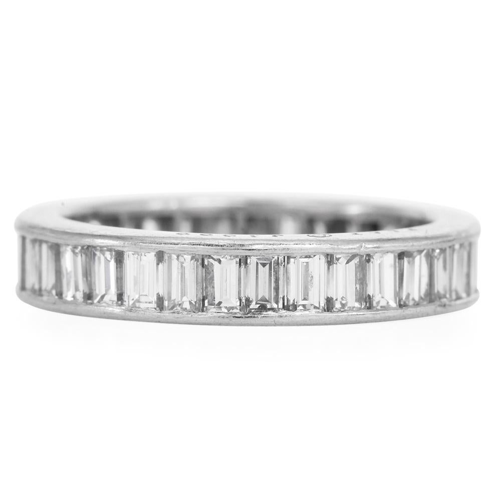 Discover the timeless elegance of the Oscar Heyman Vintage Platinum Ring. This ring showcases 35 step-cut natural emerald diamonds, totaling approximately 2.45 carats. Each diamond, graded VS1 for clarity and F-G for color, is meticulously