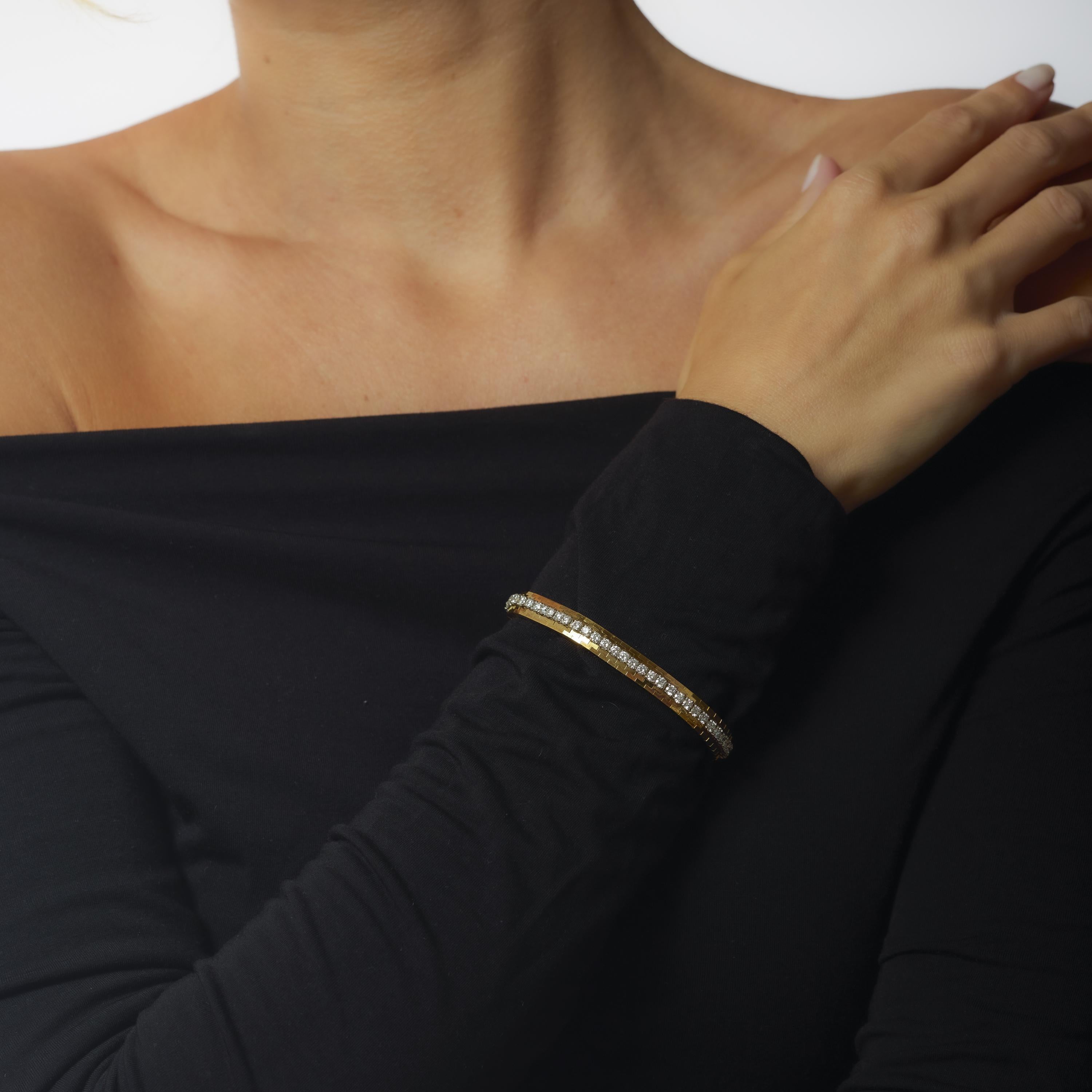 This vintage Oscar Heyman bracelet dazzles with 4.63 carats of exceptional D-E color, VS clarity diamonds, set in a luxurious combination of 18k yellow gold and platinum. Signed and numbered, this 1990s piece reflects the brand’s legacy of