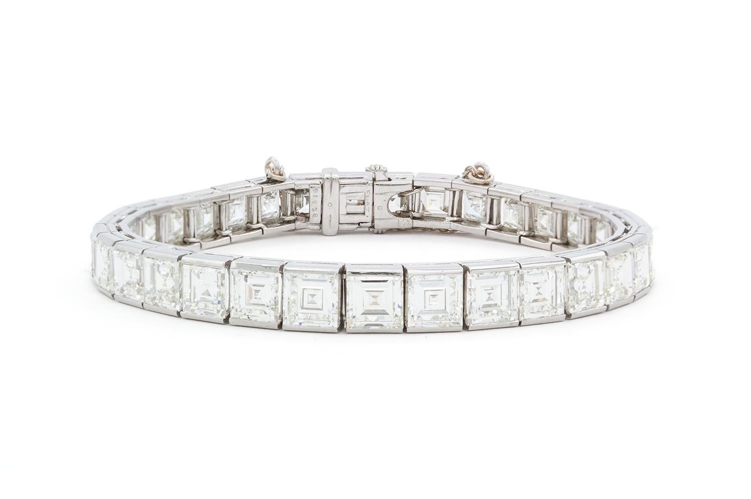 We are pleased to present this authentic Vintage Oscar Heyman Platinum and Carre Cut Diamond Line Bracelet Circa 1962. It features 33 graduated carre cut diamonds estimated at 25.00ctw H-I/VS1-VS2. They are all securely set in this stunning Oscar