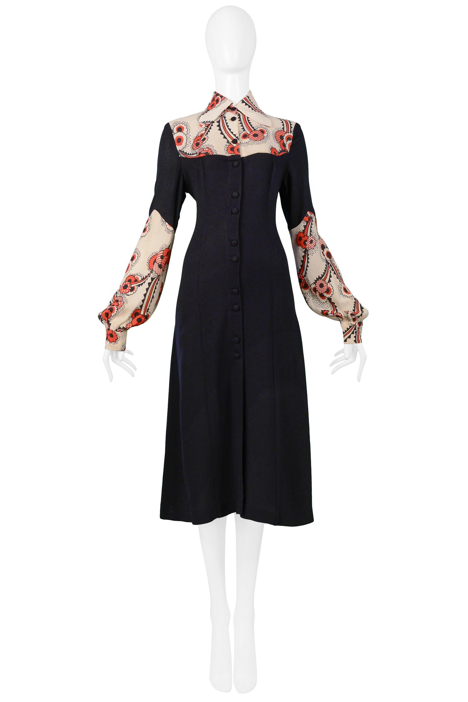 Vintage Ossie Clark black moss crepe collared dress featuring Celia Birtwell red and cream 'Floating Daisies' print, blouson sleeves and fabric covered button front closure. Circa 1968-69. 

Condition: Excellent Condition

Size: 2/4
