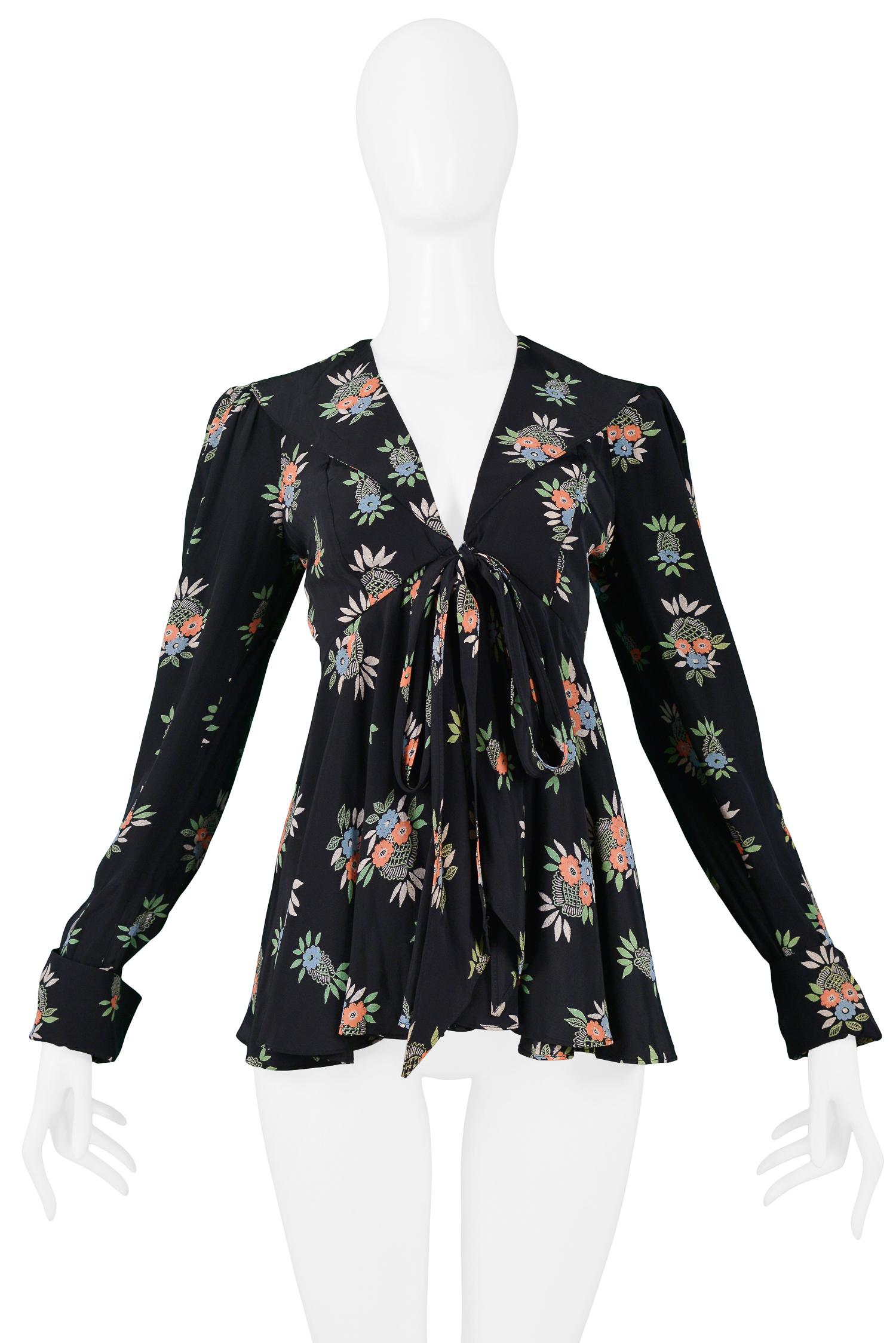 Vintage Ossie Clark black peplum top with Celia Birtwell Flower Basket print. Features a V-neckline, empire waist, and ties at front. Circa 1970s.

Excellent Vintage Condition.

Size: UK 10

Measurements:
Bust 30