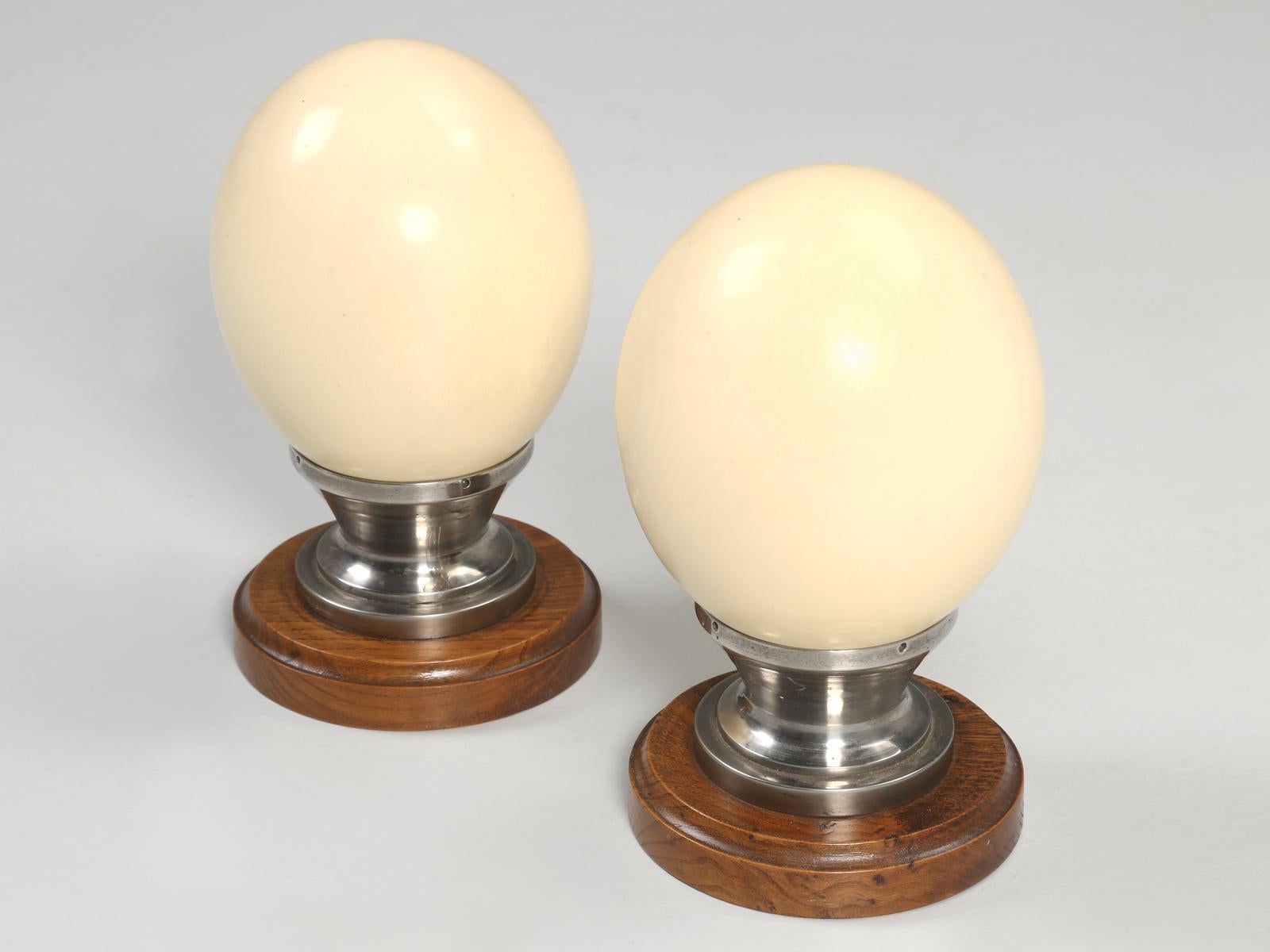 Pair of beautifully mounted Ostrich Eggs on a machined metal and wood base. Imported from France with no visible previous repairs.
One base is dated 3. 12. 1944 or Dec 3rd 1944.
