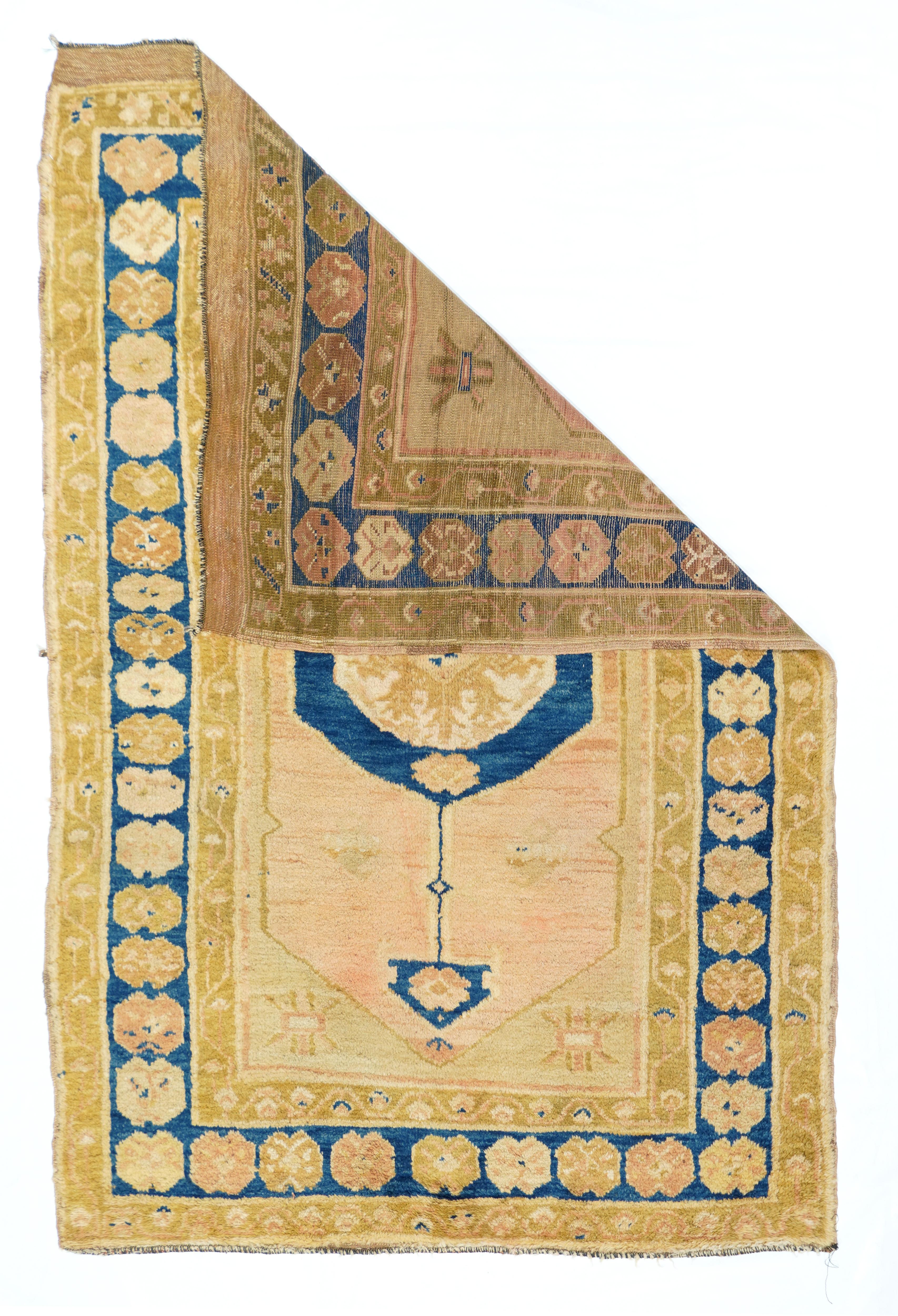 Vintage oushak rug measures: 3'10'' x 5'10''.