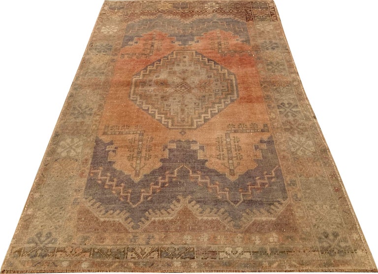 Vintage Oushak rug, circa 1940. Size: 3'9 x 5'7. Handwoven in Turkey where rug weaving is the culture rather than a business. Rugs from Turkey are known for the high quality of their wool their beautiful patterns and warm colors. These designer