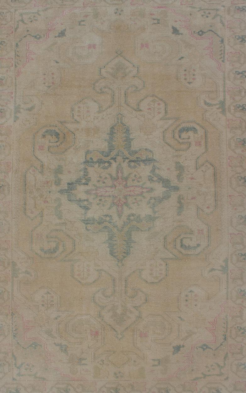 Hand-Knotted Vintage Oushak Rug from Turkey with Muted Colors and Floral Medallion For Sale