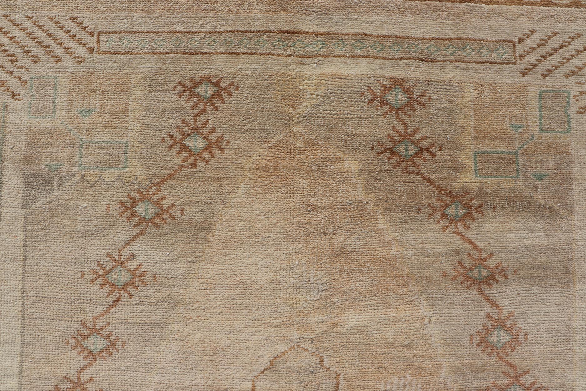 Turkish Vintage Oushak Rug from Turkey with Muted Colors and Tribal Medallion For Sale