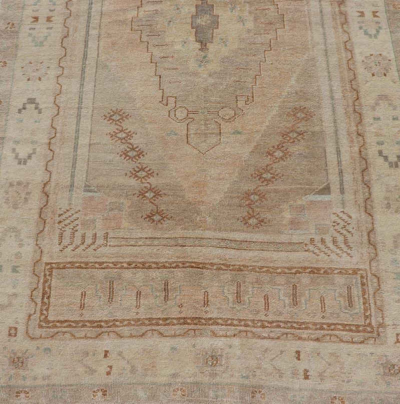 Hand-Knotted Vintage Oushak Rug from Turkey with Muted Colors and Tribal Medallion For Sale