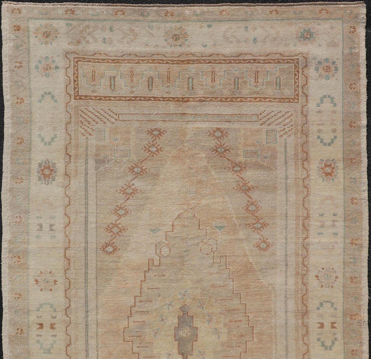 Vintage Oushak Rug from Turkey with Muted Colors and Tribal Medallion In Good Condition For Sale In Atlanta, GA