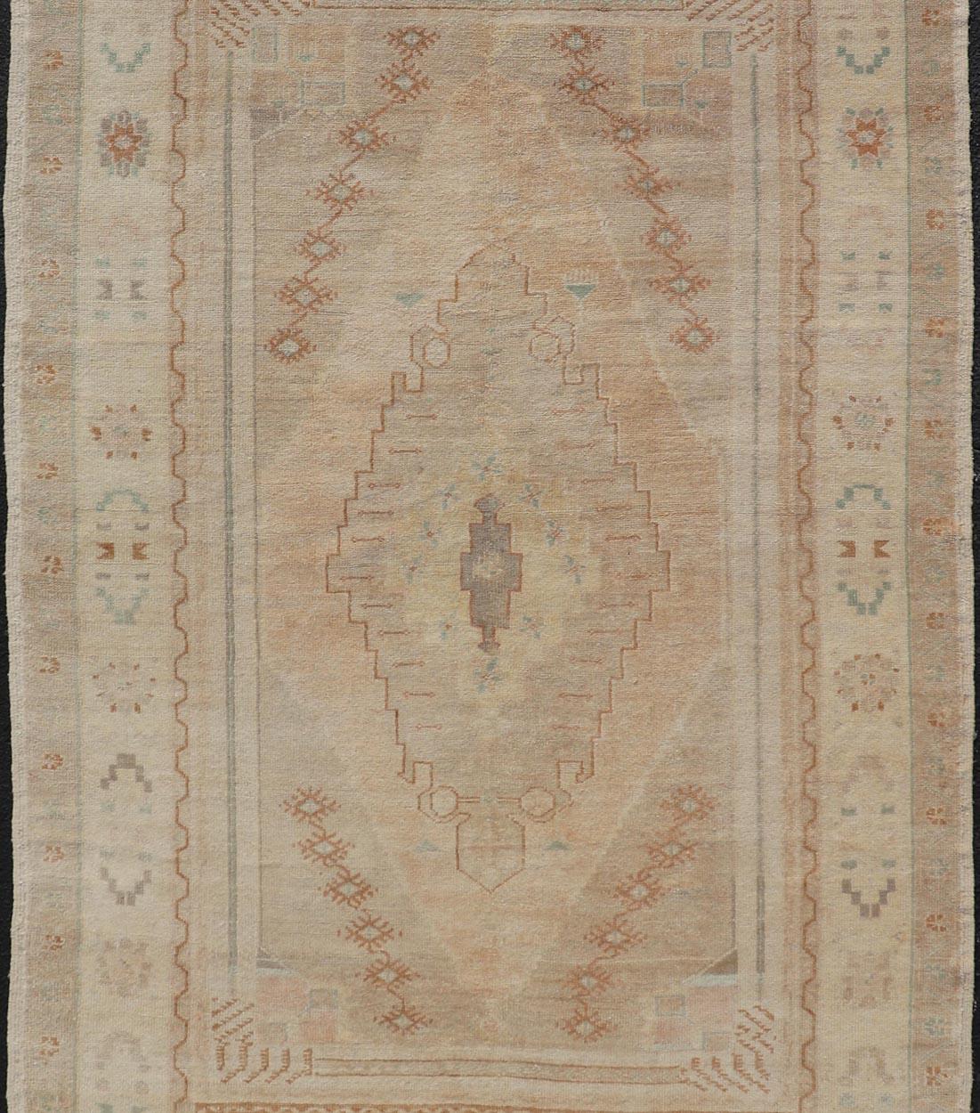 20th Century Vintage Oushak Rug from Turkey with Muted Colors and Tribal Medallion For Sale
