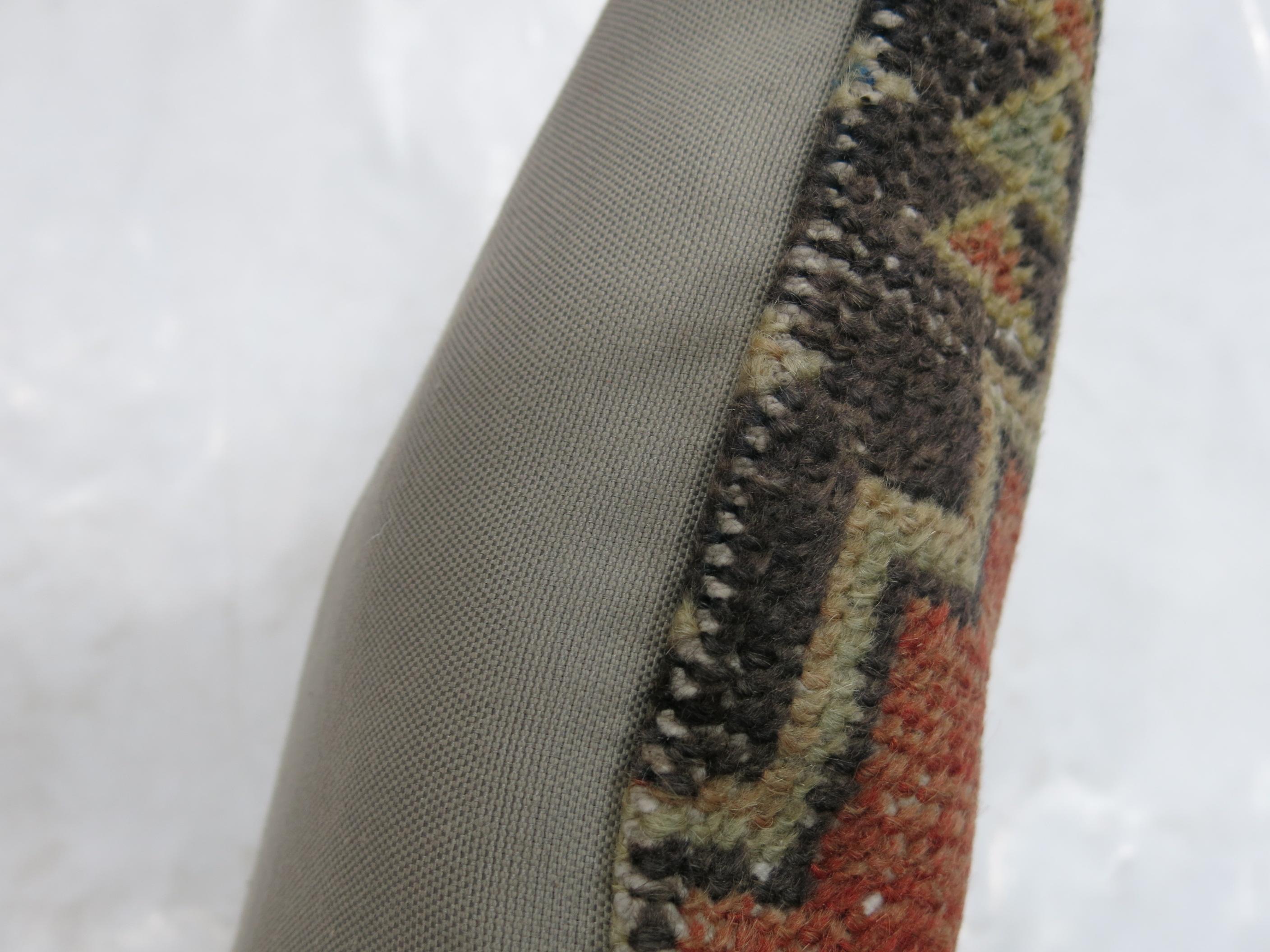 Pillow made from a vintage Turkish Oushak rug with cotton back. Zipper closure and foam insert provided.