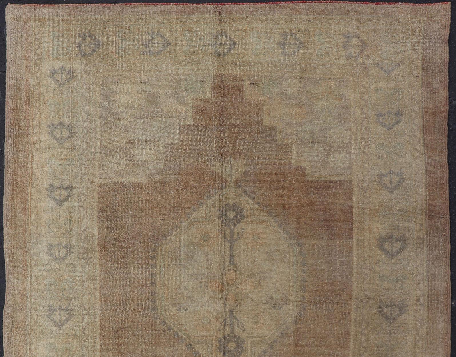 Hand-Knotted Vintage Oushak Rug Rug with Mocha Color and Pale Neutral Tones For Sale
