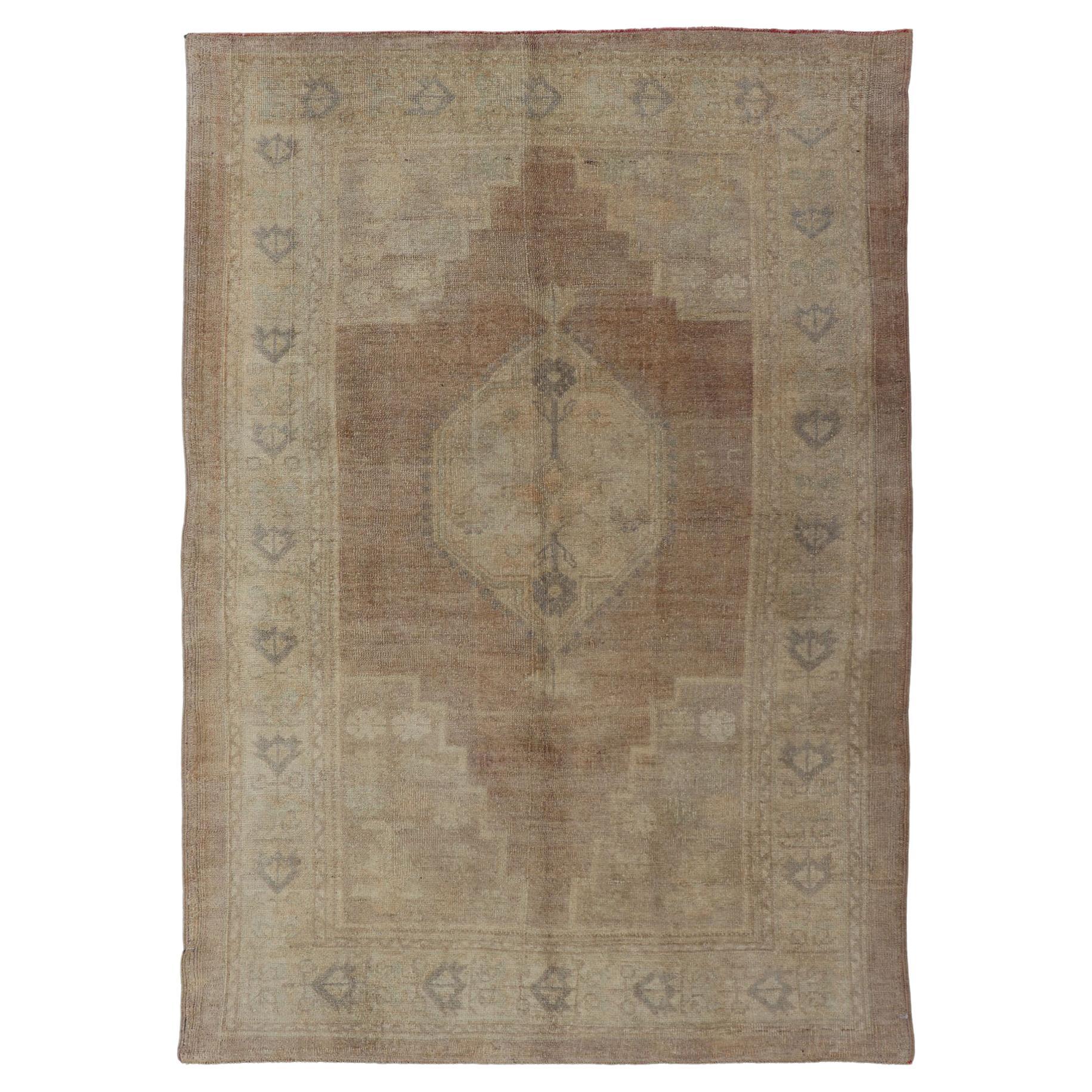 Vintage Oushak Rug Rug with Mocha Color and Pale Neutral Tones For Sale