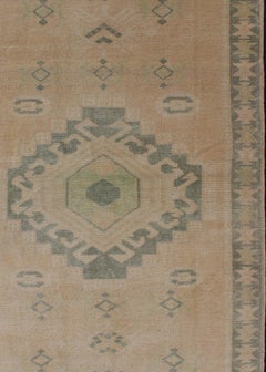 Vintage Oushak Rug with Central Medallion Warm Tones And Green Tones