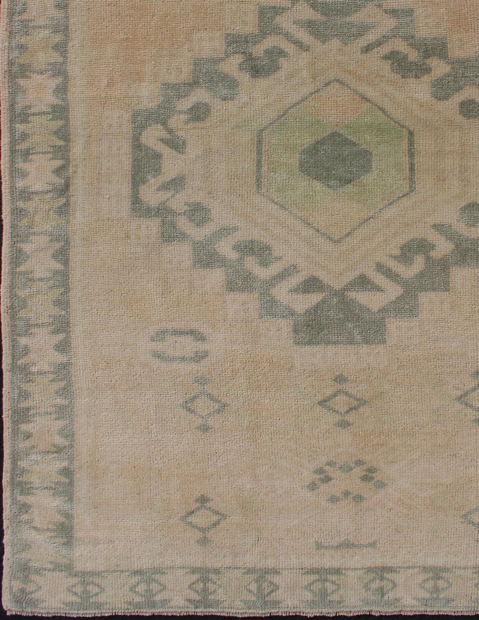 Turkish Vintage Oushak Rug with Central Medallion Warm Tones And Green Tones For Sale