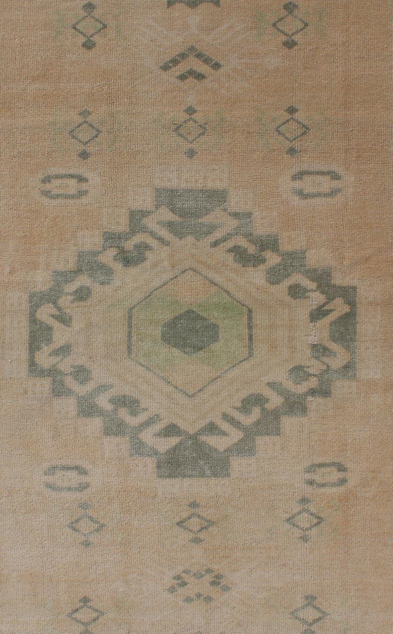 Hand-Knotted Vintage Oushak Rug with Central Medallion Warm Tones And Green Tones For Sale