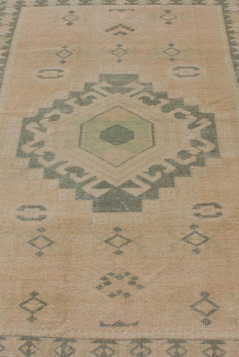 20th Century Vintage Oushak Rug with Central Medallion Warm Tones And Green Tones For Sale