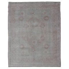 Oushak-Teppich im Vintage-Stil mit pastellfarbenen Farben in Braun, Grün, Buttergelb und Rosa