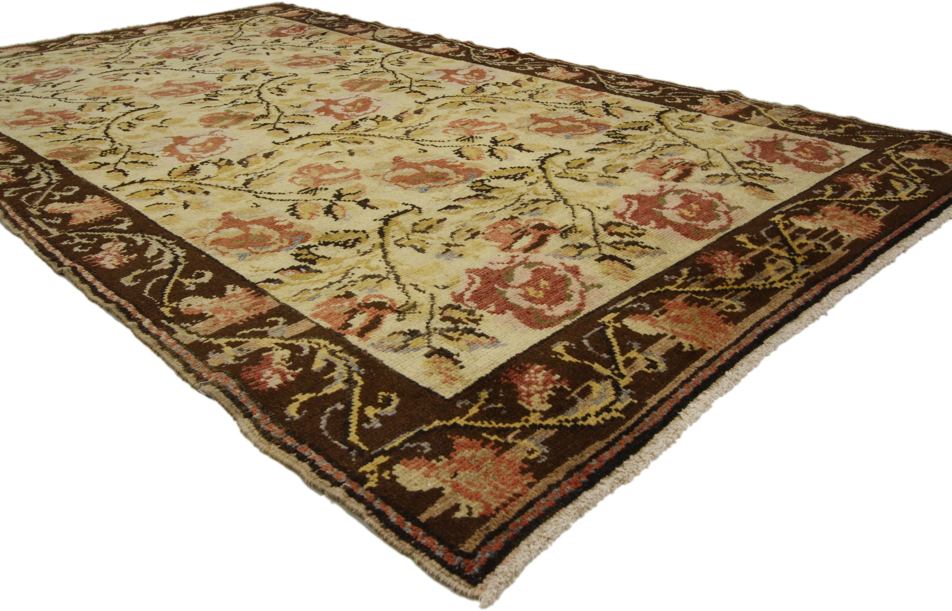 50093, Vintage Oushak Rug with Traditional English Country Garden Design 04'00 x 07'00. This hand-knotted wool vintage Oushak features an allover garden design composed of red and dusty pink roses on a warm beige field. Roses bloom from chocolate