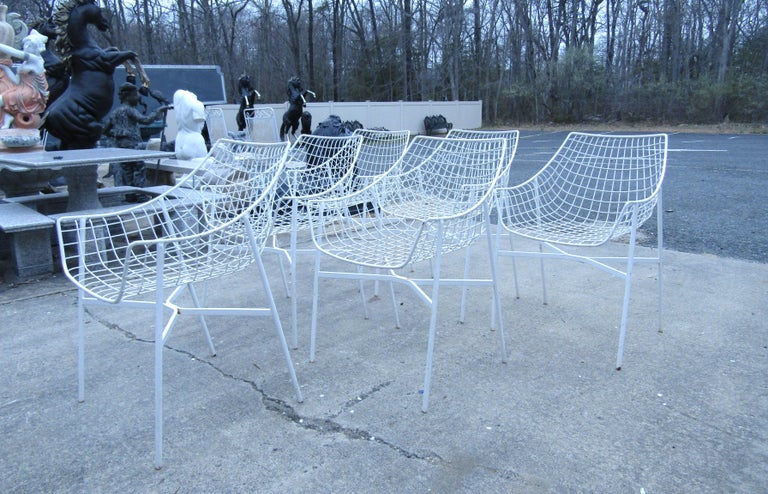(6) vintage outdoor egg chairs. These sturdy chairs feature a white wire metal design perfect for any outdoor or patio setting. Pair these chairs with any vintage outdoor table for a stylish mid century backyard motif. Please confirm item location