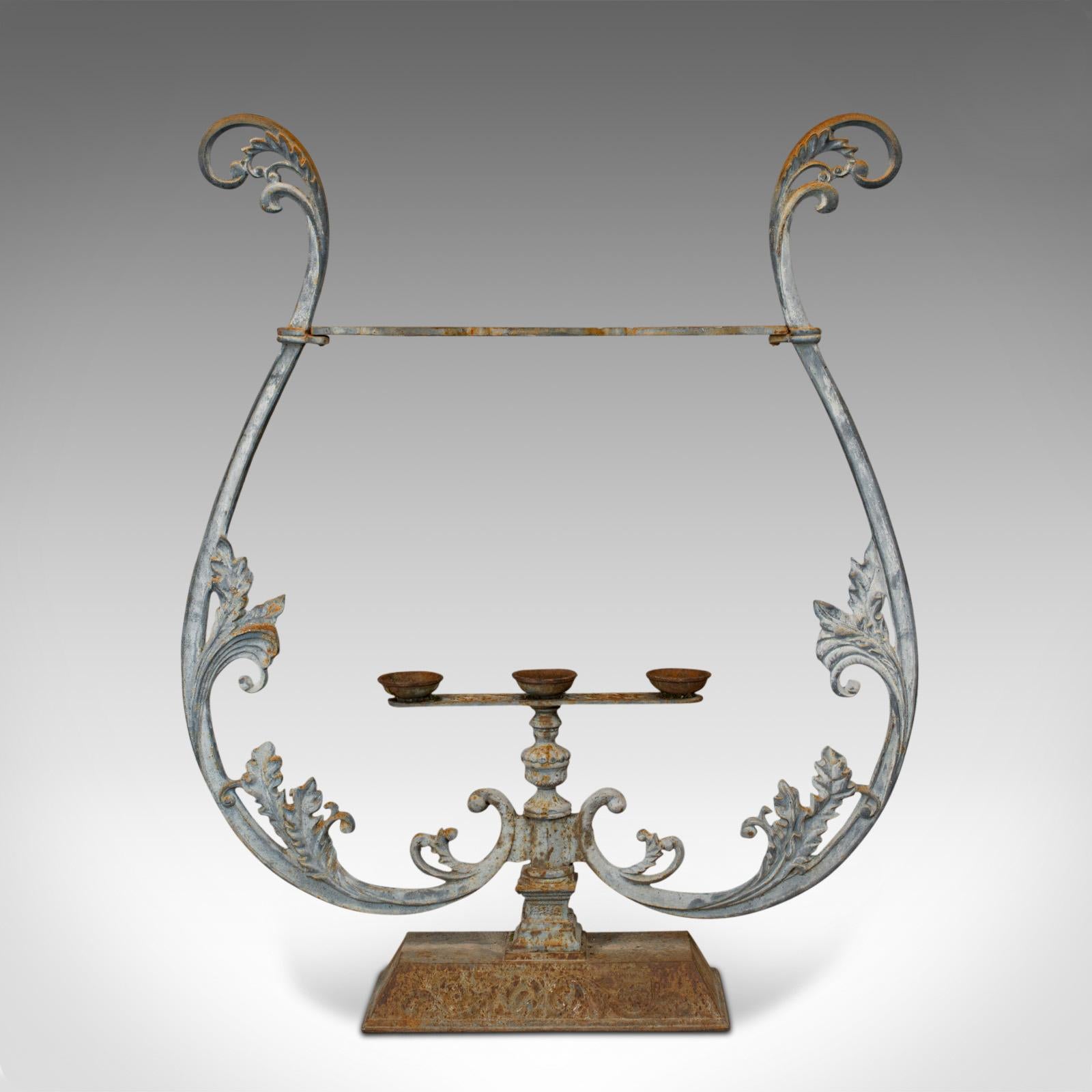 This is a vintage outdoor stand. A French, cast iron planter or stick stand with Art Nouveau taste, dating to the mid-20th century, circa 1950.

Appealing foliate detail abounds
Displays a desirable aged patina
Cast iron finished in light