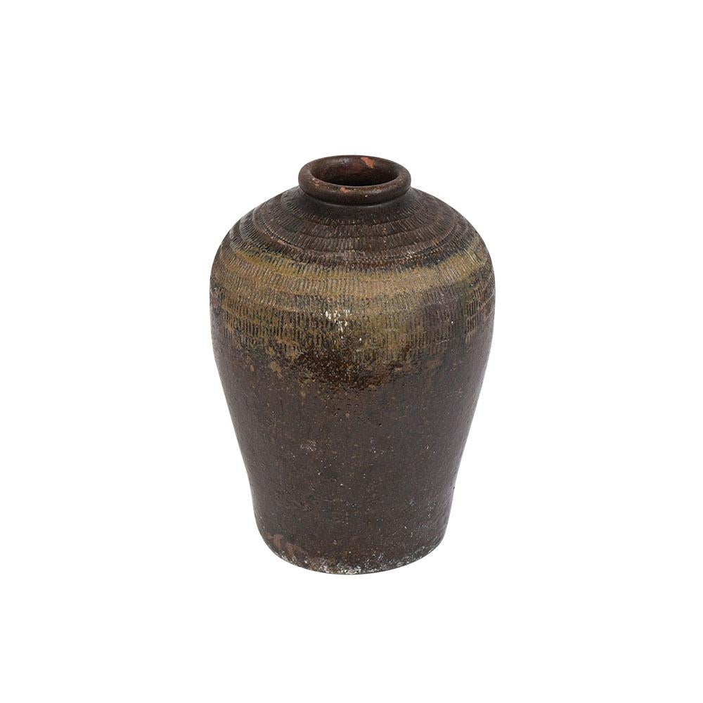 A Large Ceramic In/Outdoor Vase in good condition, handcrafted, and comes with hand-sculpted details around the top. The vase is a beautiful dark brown and green color combination with its original glazed finish. This Vase is ready to be used in any