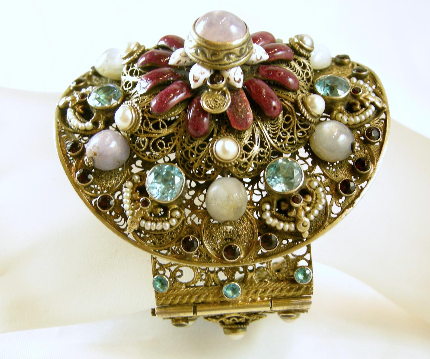 You don’t come across pieces like this any more and when you do … it takes your breathe away.  I believe this bracelet is from the 30s and is Austro Hungarian.  It has antique gold tone filigree metal throughout.  The main circle piece has star