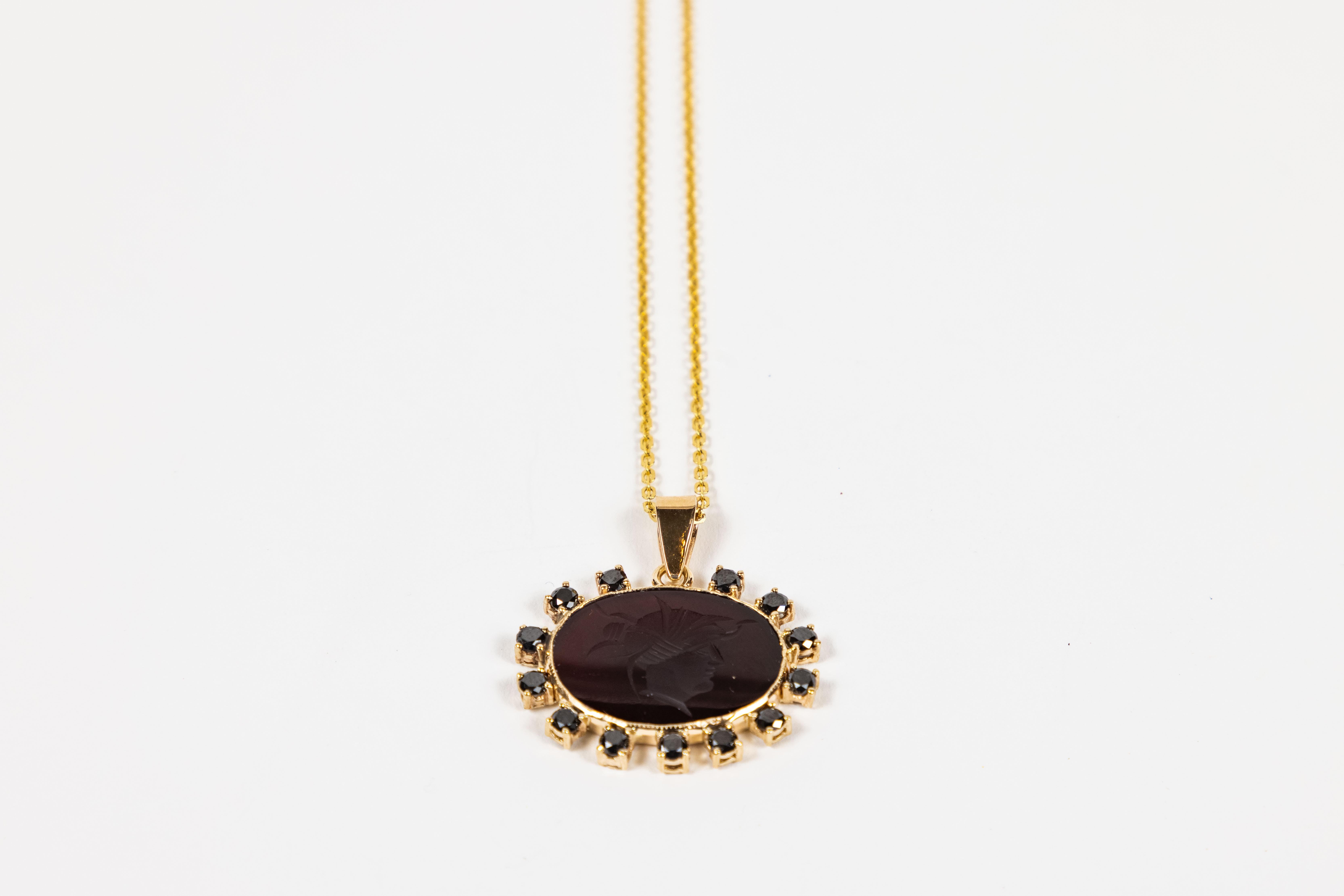 This custom pendant is made from a handsome oval Agate Intaglio from a vintage cuff link.
The Agate is then set in 14KT Gold with a 1.28 CT shimmering Black Diamond surround and paired with a new 18