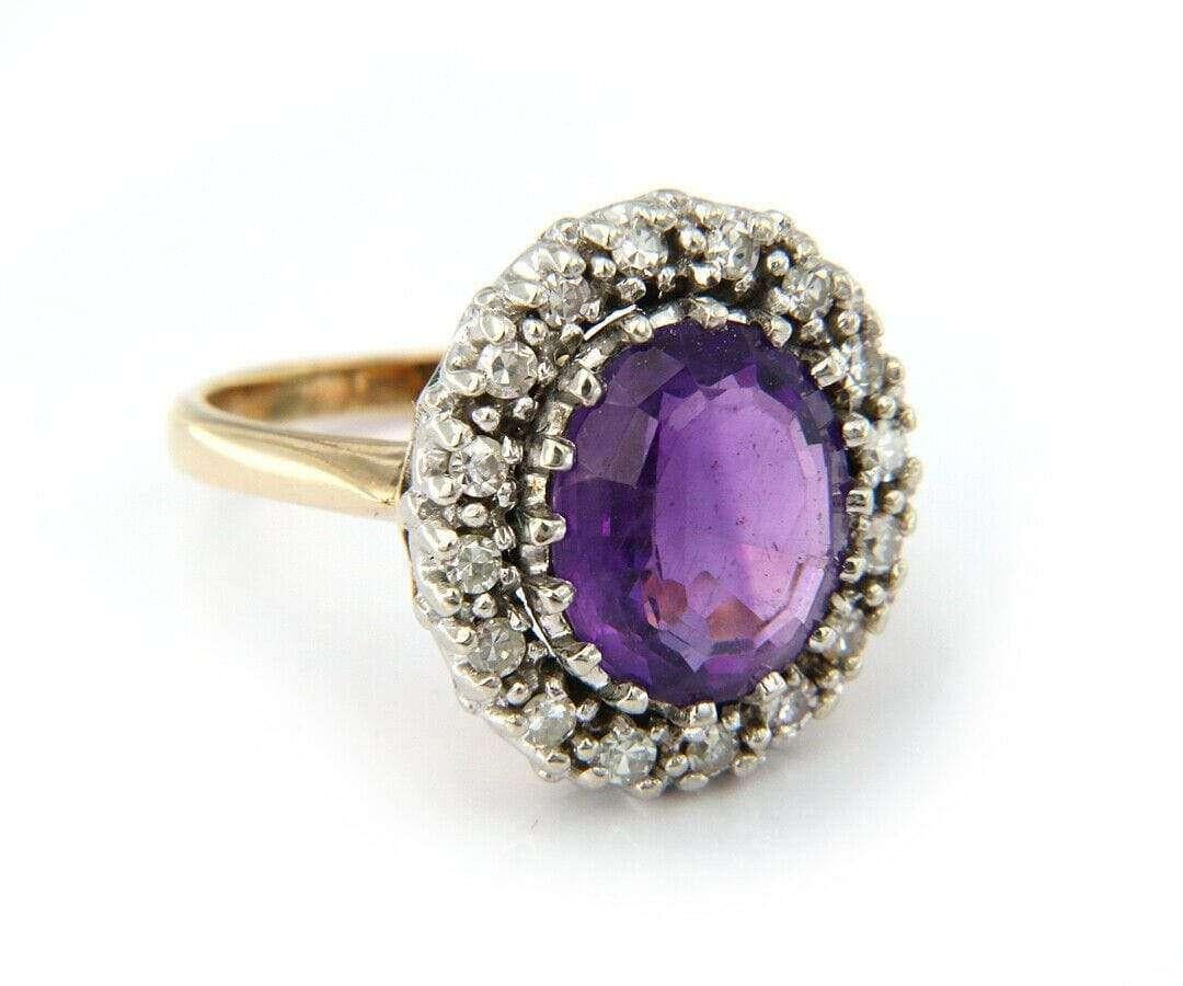 Vintage Oval Amethyst and Diamond Halo Ring In 14K

Oval Amethyst And Diamond Halo Ring
14K Yellow Gold
Amethyst Dimensions: Approx. 9.8 X 12.2 X 5.8 MM
Diamond Carat Weight: Approx. 0.40 CTW
Band Width: Approx. 2.0 MM
Ring Size: 7.75 (US)
Weight: