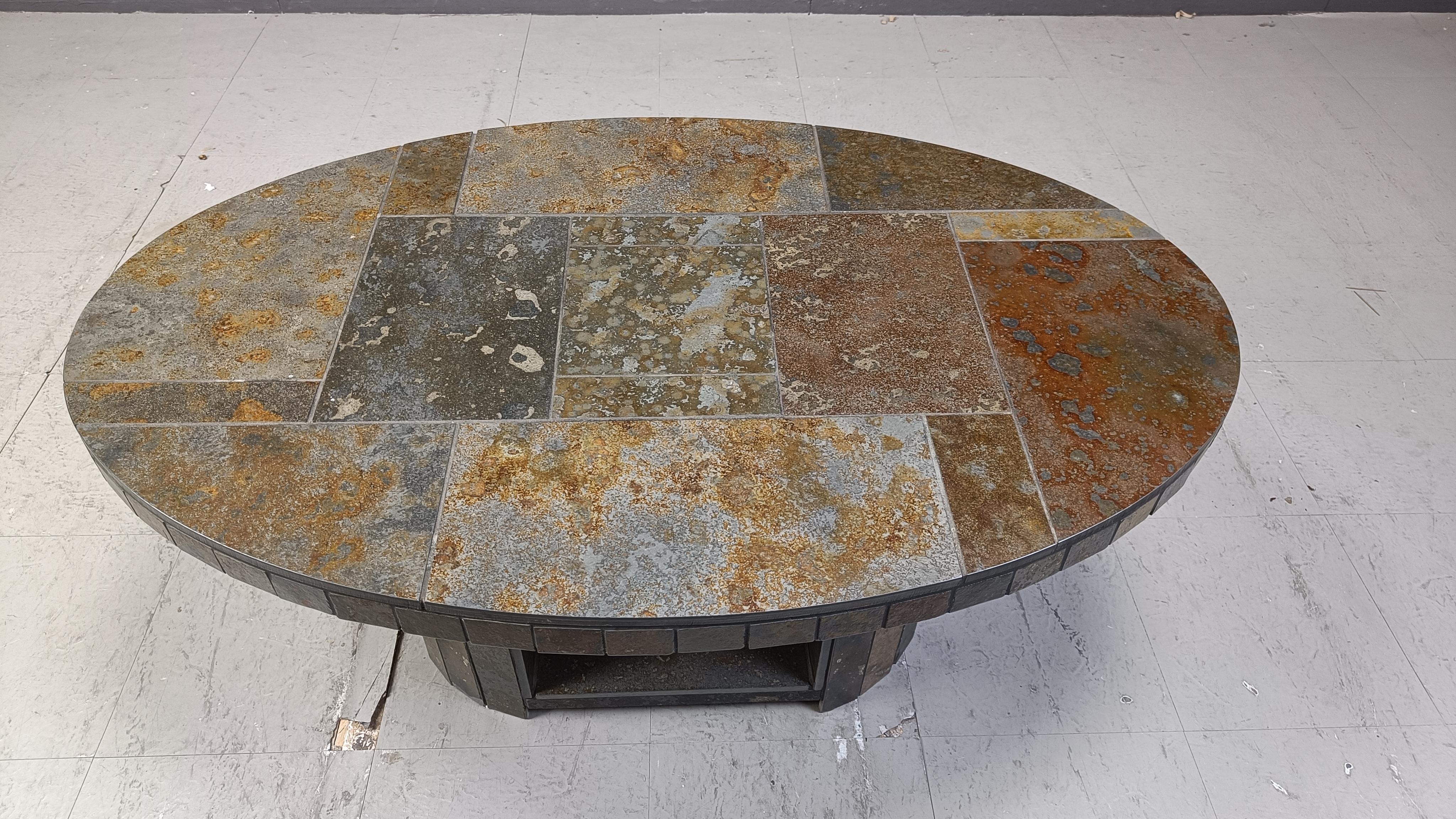 Vintage oval brutalist stone coffee table.

Beautifully tiled stones with gorgeous brown/green/beige colours.

1970s - Germany

Height: 45cm
Width: 110cm
Depth: 70cm

Ref.: 2503050406