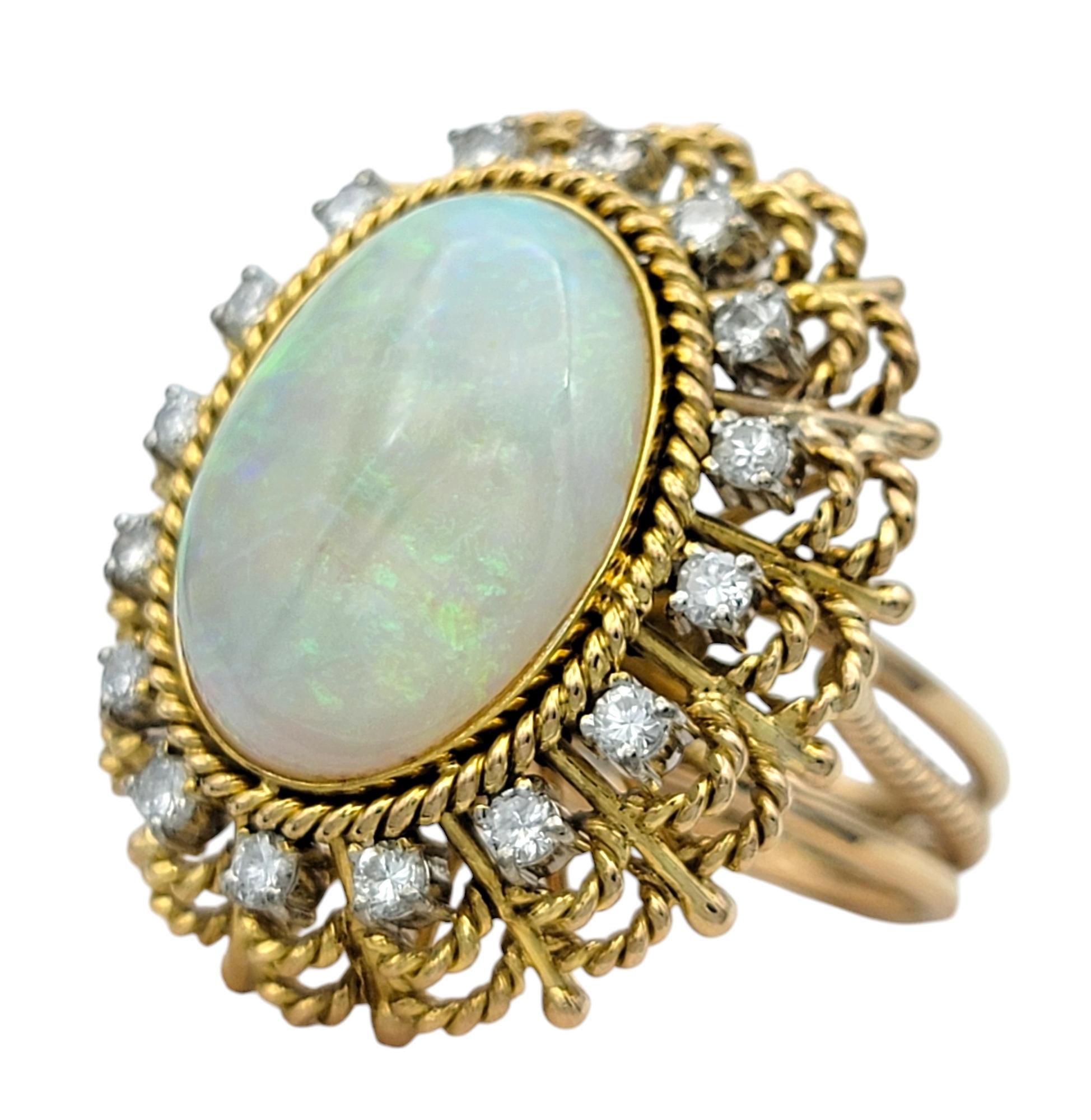 Contemporary Vintage Oval Cabochon Opal and Diamond Halo Cocktail Ring 14 Karat Yellow Gold For Sale