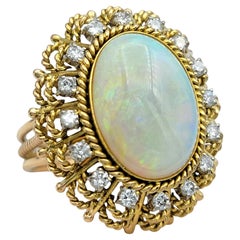 Vintage Oval Cabochon Opal and Diamond Halo Cocktail Ring 14 Karat Yellow Gold