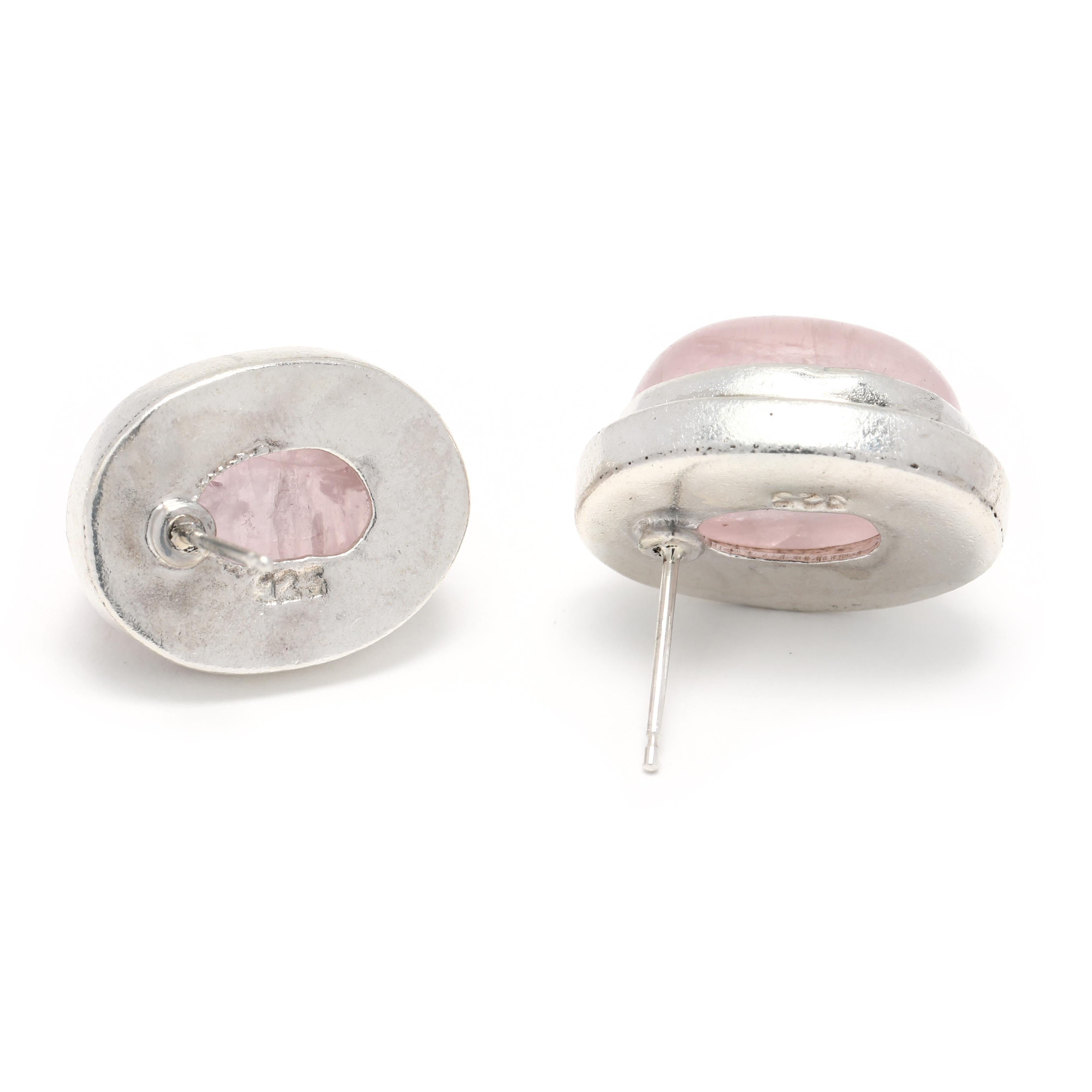 These vintage oval cabochon rose quartz stud earrings will add a touch of elegance to any look. Set in sterling silver, the large rose quartz stones measure 3/4 inch in length and feature a classic cabochon cut. The simple pink stones will add a