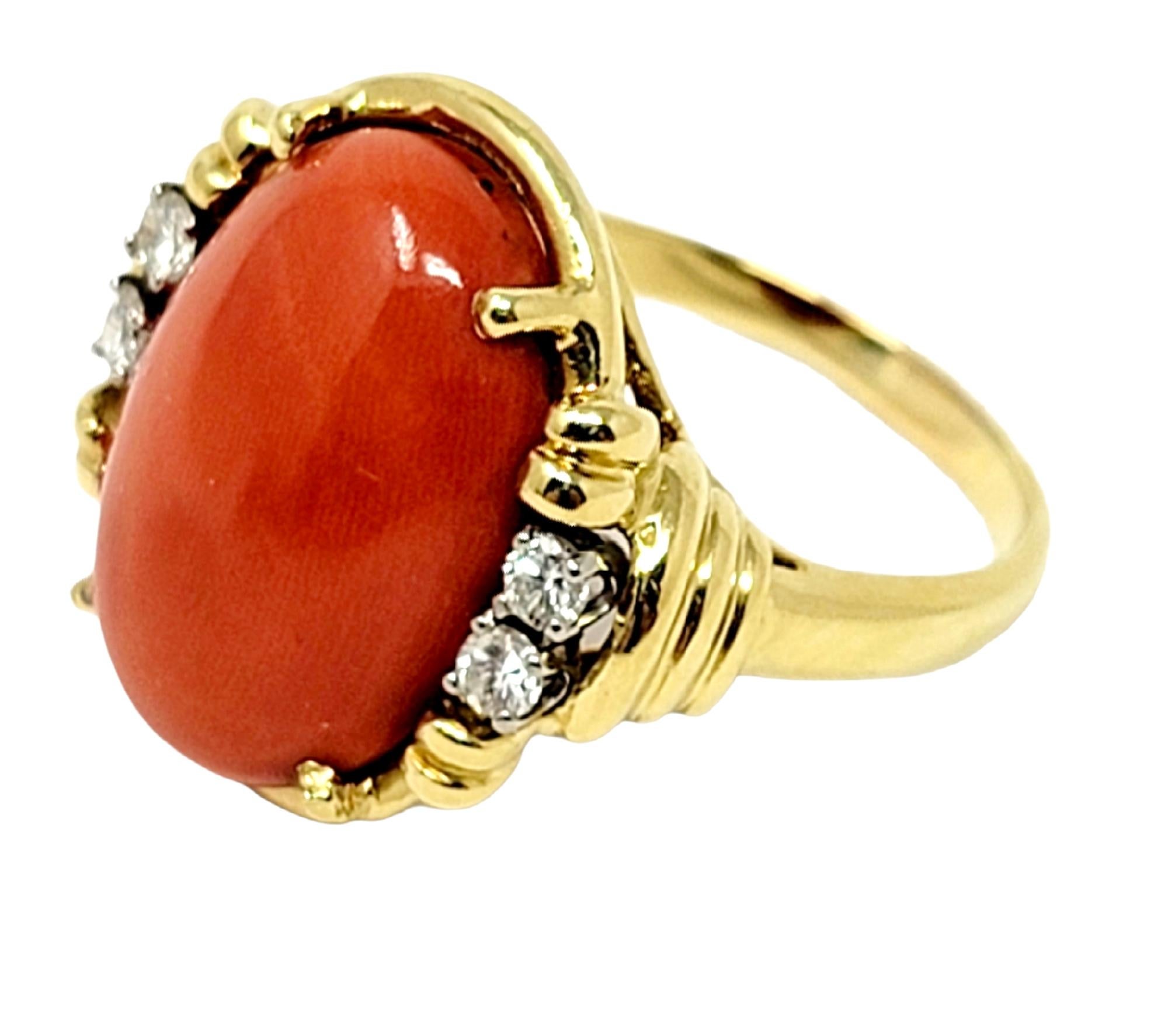 Ring size: 8.75

Featured here is a colorful, elegant vintage coral and diamond cocktail ring. The bright reddish-orange oval stone has a gorgeous high polished finish with several sparkling side diamonds to give it a an extra touch of glamour.