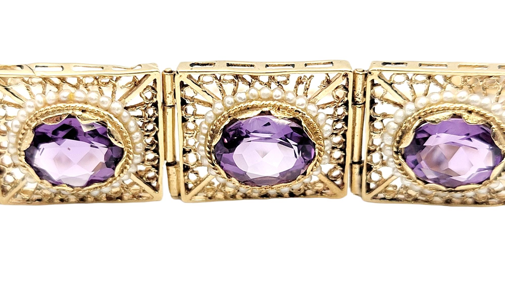 Stunning, intricately detailed amethyst and seed pearl link bracelet with delicate filigree design. 

Metal: 14K Yellow Gold
Weight: 32.5 grams
Amethyst: 18.89 ctw
Amethyst cut: Oval
Amethyst color: Medium Light Purple
Seed Pearl Count: 252
Bracelet