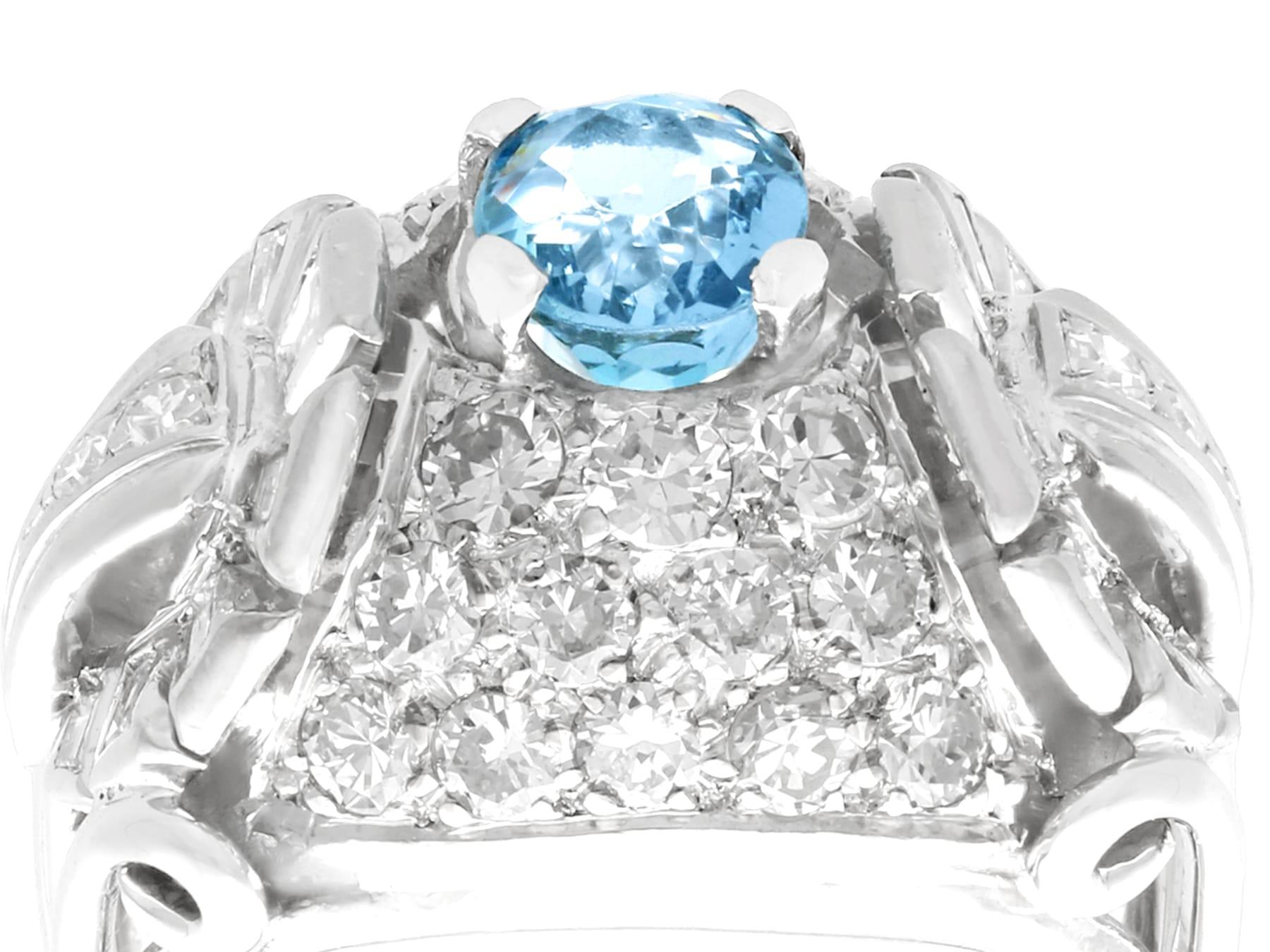 A stunning, fine and impressive vintage 0.95 carat aquamarine, 2.06 carat diamond and palladium cocktail ring; part of our diverse vintage jewelry and estate jewelry collections.

This stunning, fine and impressive vintage oval cut aquamarine ring