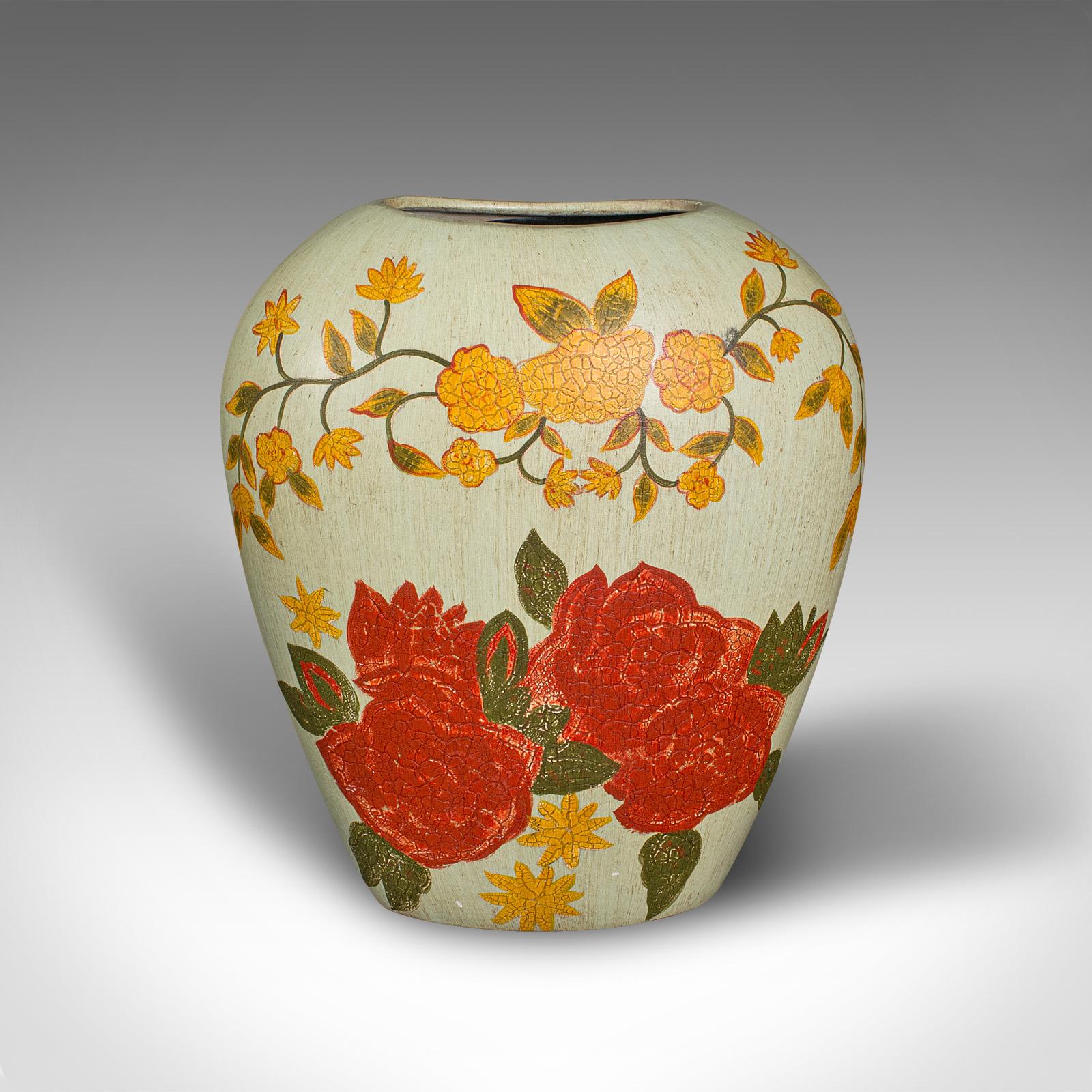 This is a vintage oval flower vase. A Spanish, hand-painted ceramic planter, dating to the mid 20th century, circa 1960.

Charmingly vibrant with a delightful hand-painted appeal
Displays a desirable aged patina and in good order
Oval bulb form with