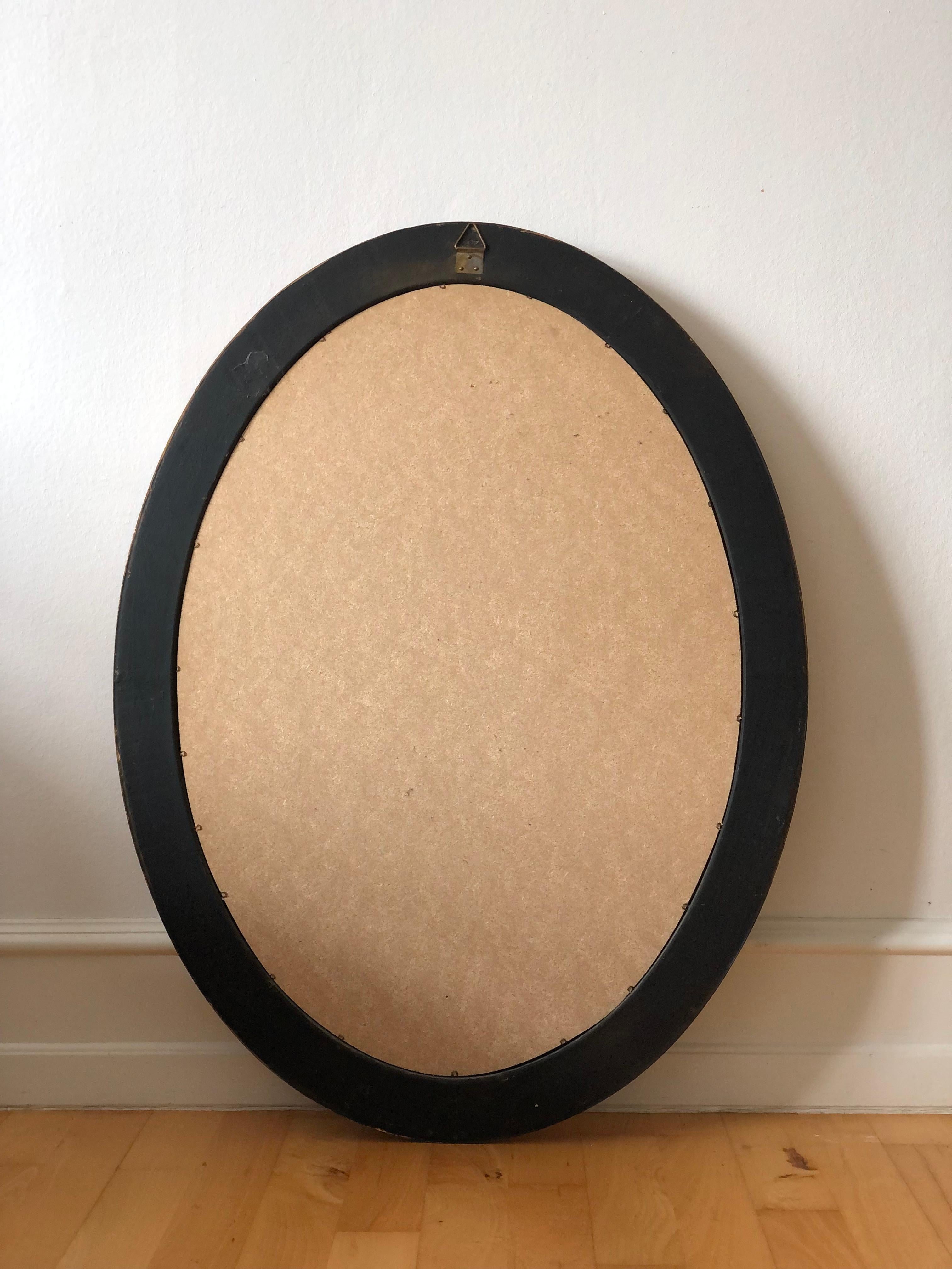 Bois Miroir ovale vintage en bois doré Belgique en vente