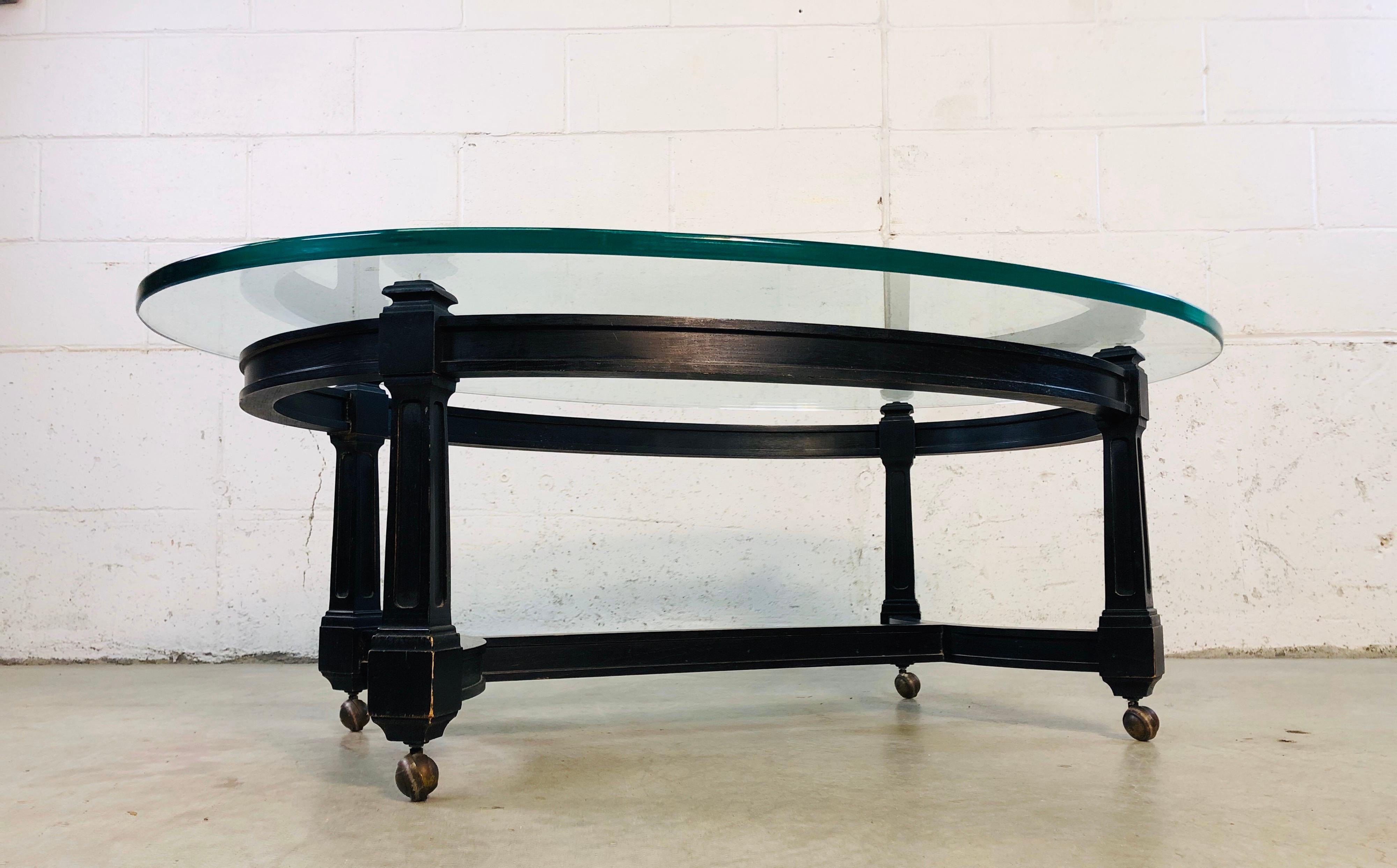 20th Century Vintage Oval Glass Top and Black Wood Coffee Table