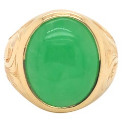 Vintage Oval Green Jade Ring with Engraved Shoulders in 14k Yellow Gold