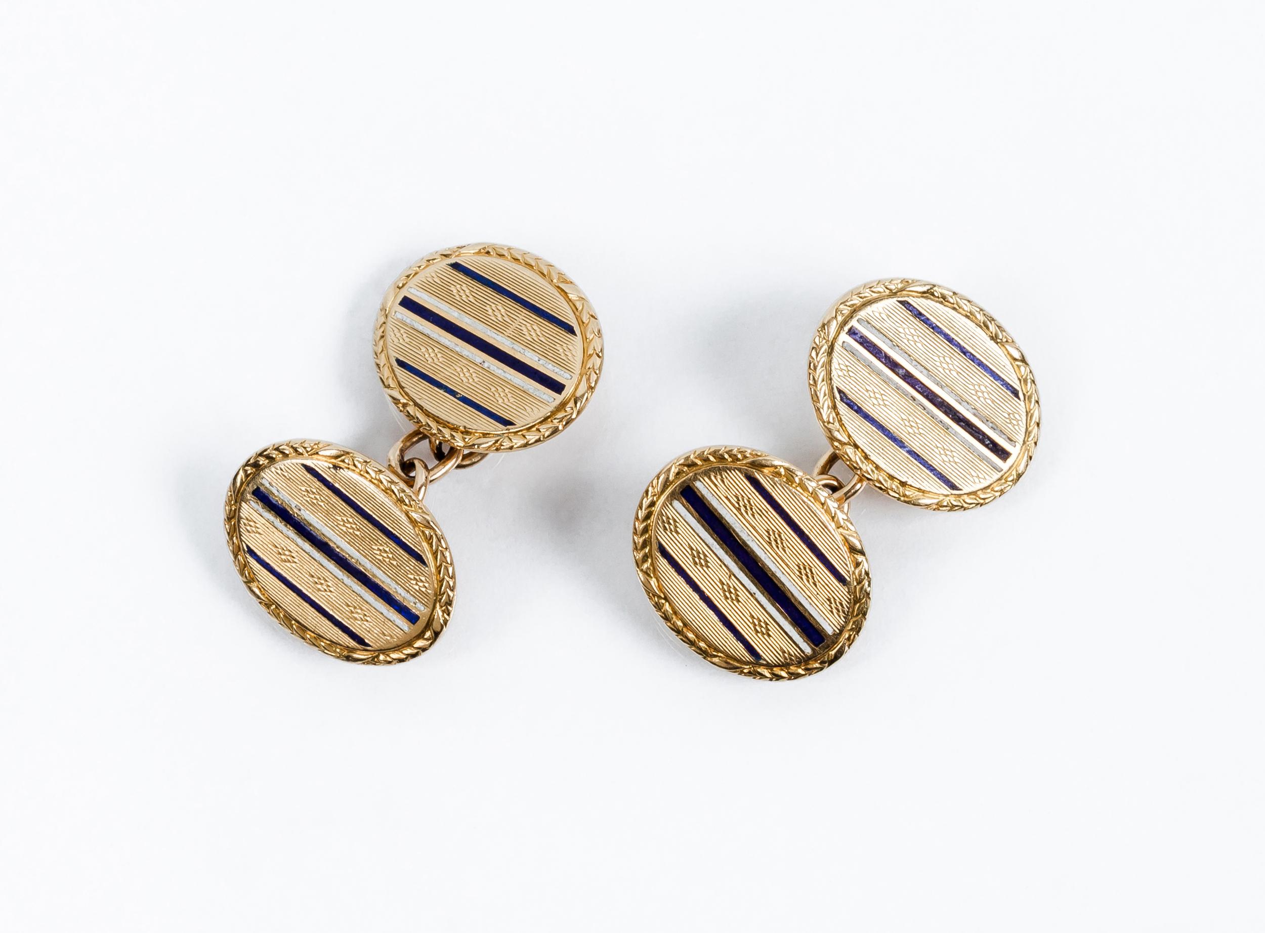 Vintage Oval Yellow Gold Cufflinks
Vintage cufflinks in yellow gold with double oval motifs, decorated in alternating engraved bands with blue and white enamel lines
Weight 8,5 gr
 Dimensions  14 x 12 mm

PRADERA is a second generation of a family