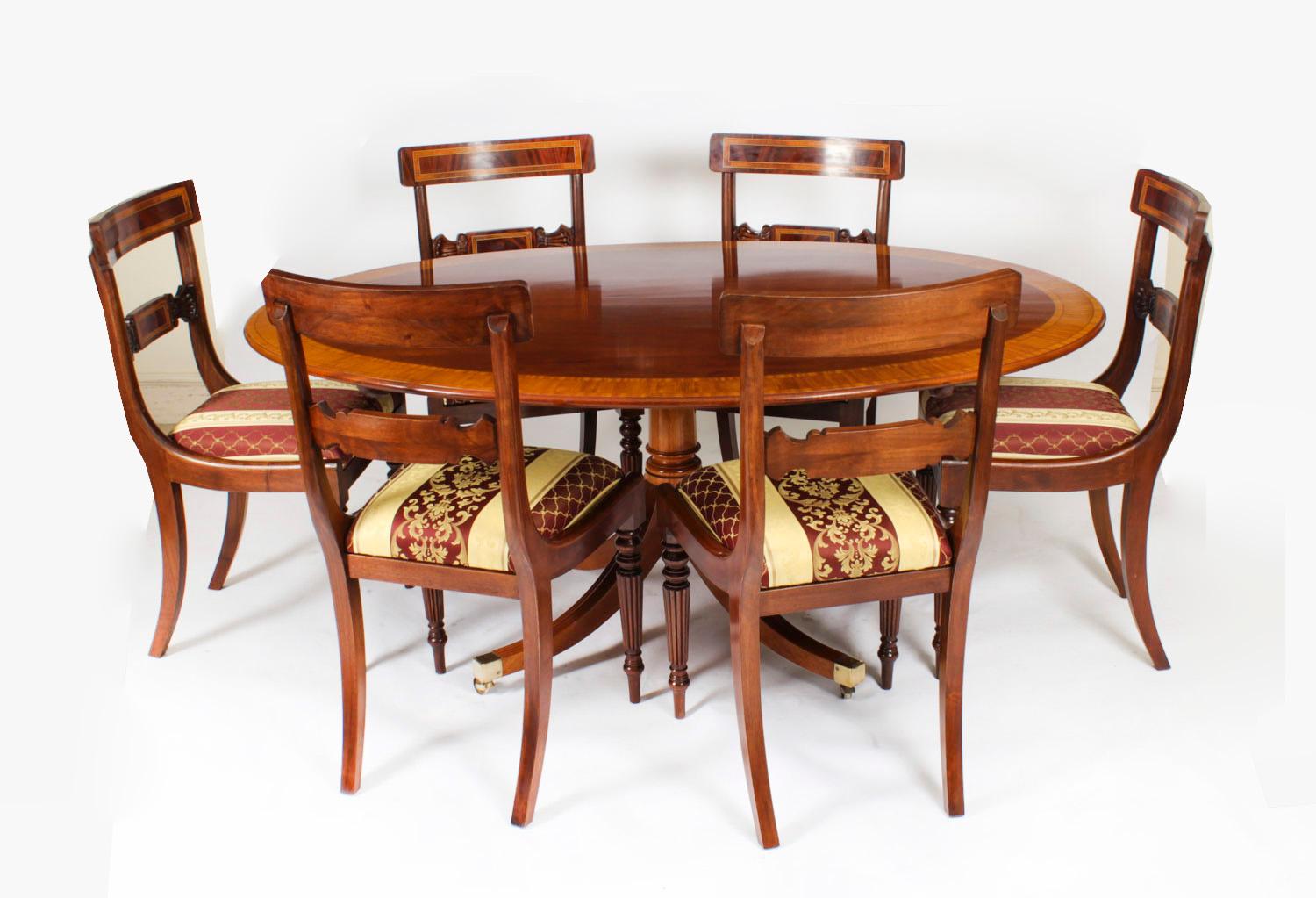 This is a beautiful Regency Revival flame mahogany and Satinwood banded oval dining table  that was made by the Master Cabinet maker William Tillman and bears his label on the underside, Circa 1980 in date.  


The fabulous 5ft 6inch flame mahogany