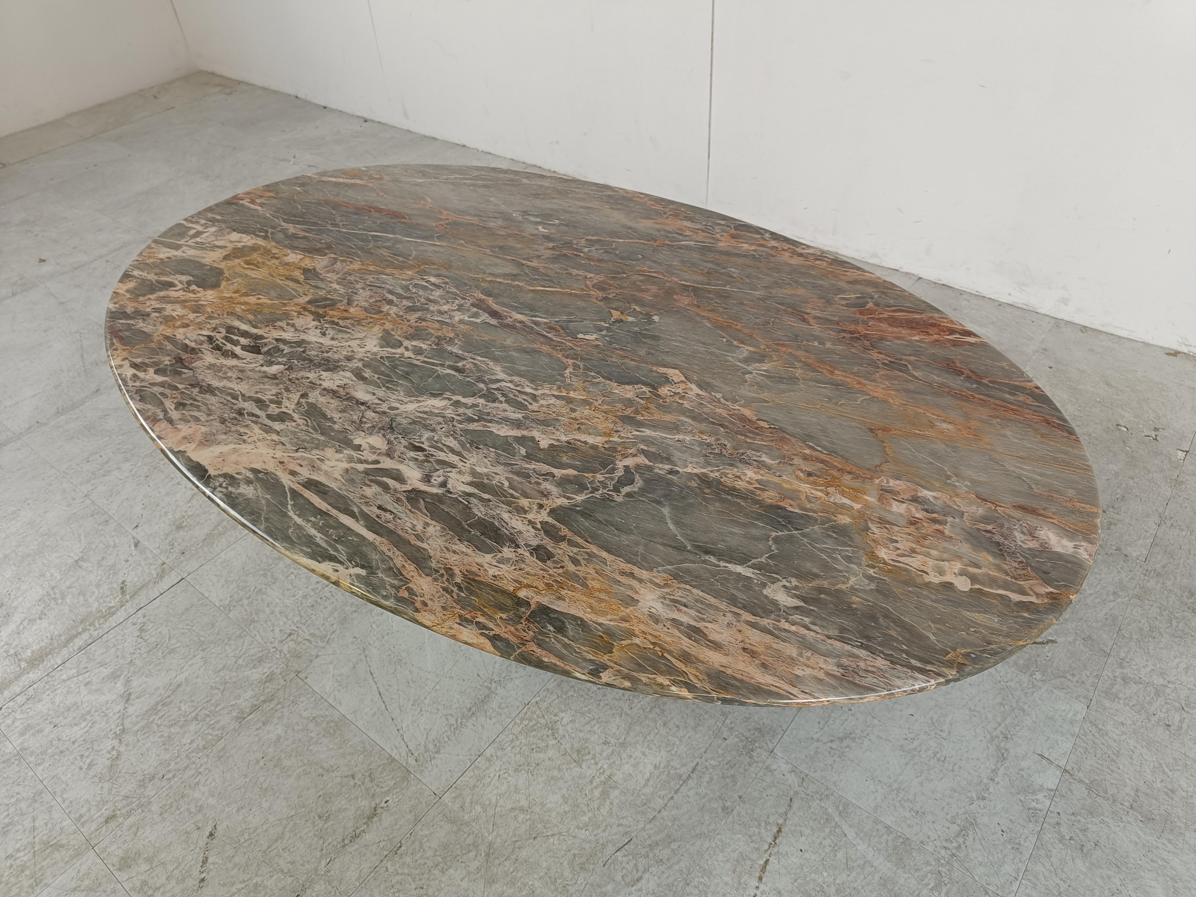 Elegant marble coffee table with an oval table top resting on a stepped marble base.

Great colour and veining

Very good condition.

1970s - Italy

Dimensions
Height: 47cm/18.50