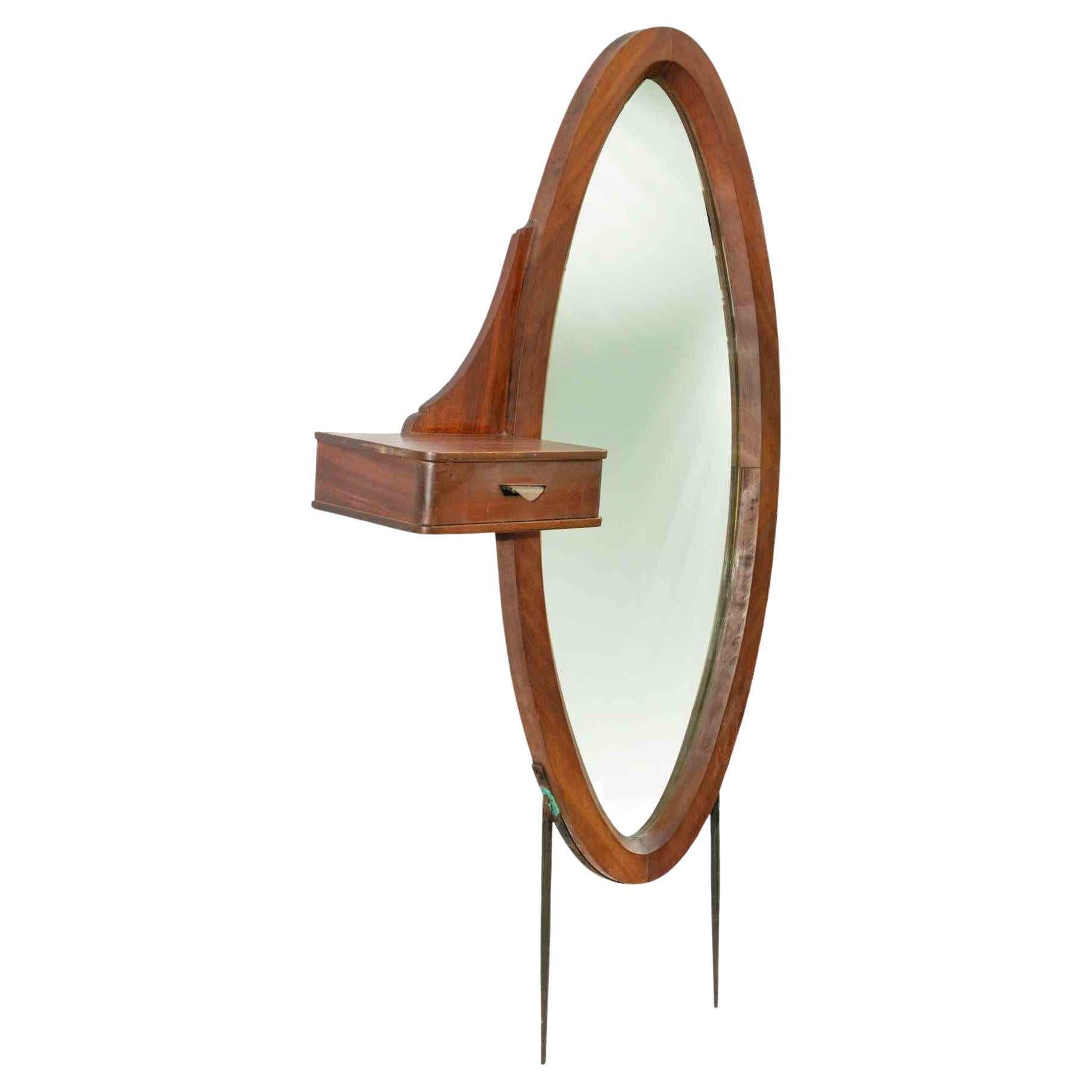 Vintage oval mirror is an original design item realized in the mid-20th century.

A vintage wooden mirror with a little drawer. Can be mounted with or without legs.

Don't miss this design mirror
