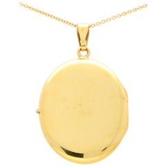 Vintage Oval Photo Locket Set in 18 Karat Yellow Gold