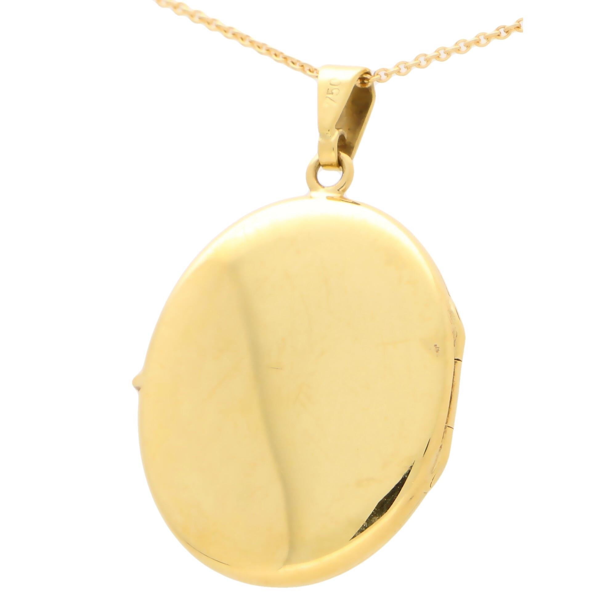 An elegant oval locket set in 18k yellow gold.

The piece is designed in the classic oval locket shape and once opened has two spaces to place small photographs. Due to the design the locket could easily be worn for everyday. The catch on this piece